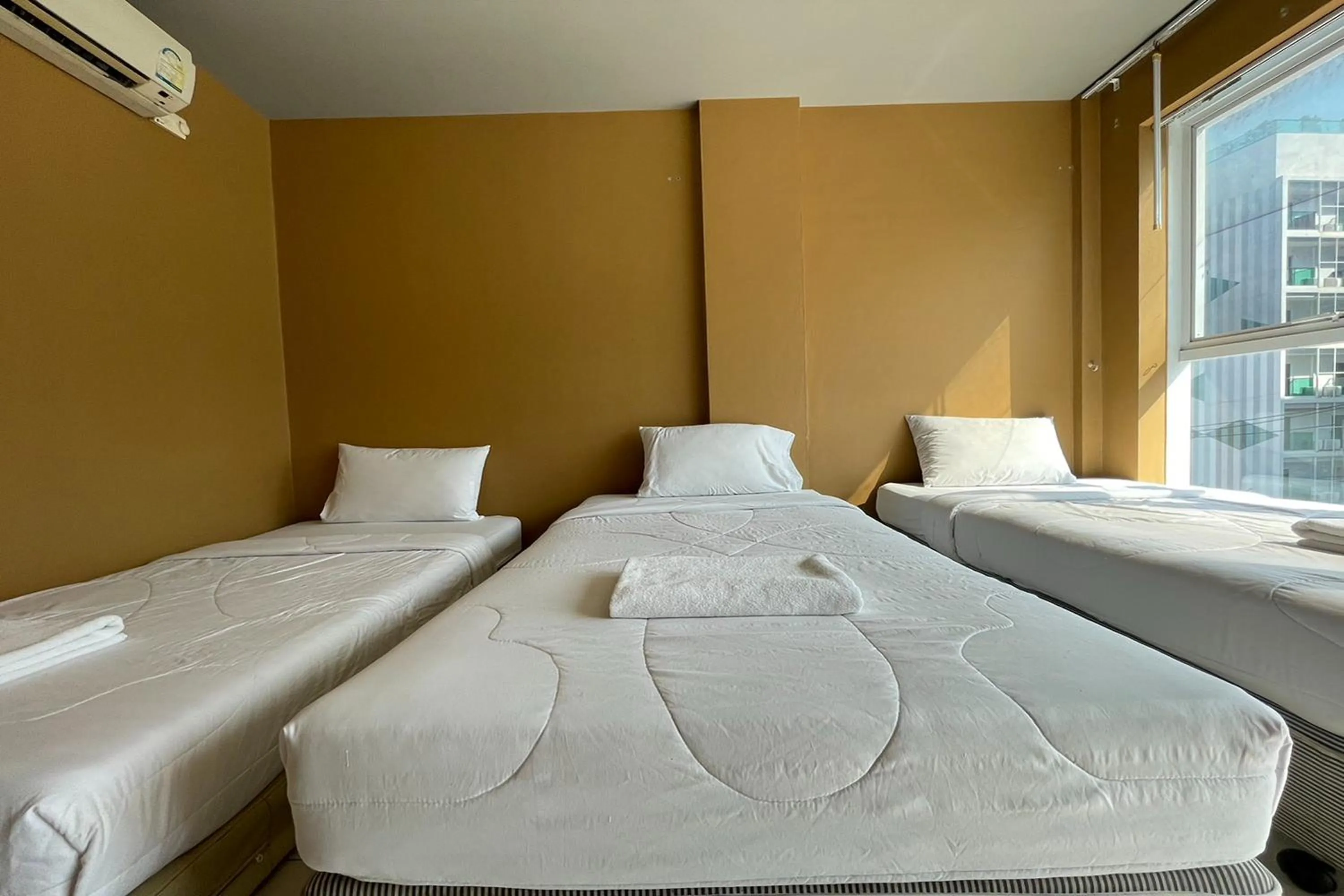 Bed in Landmark Patong Hotel