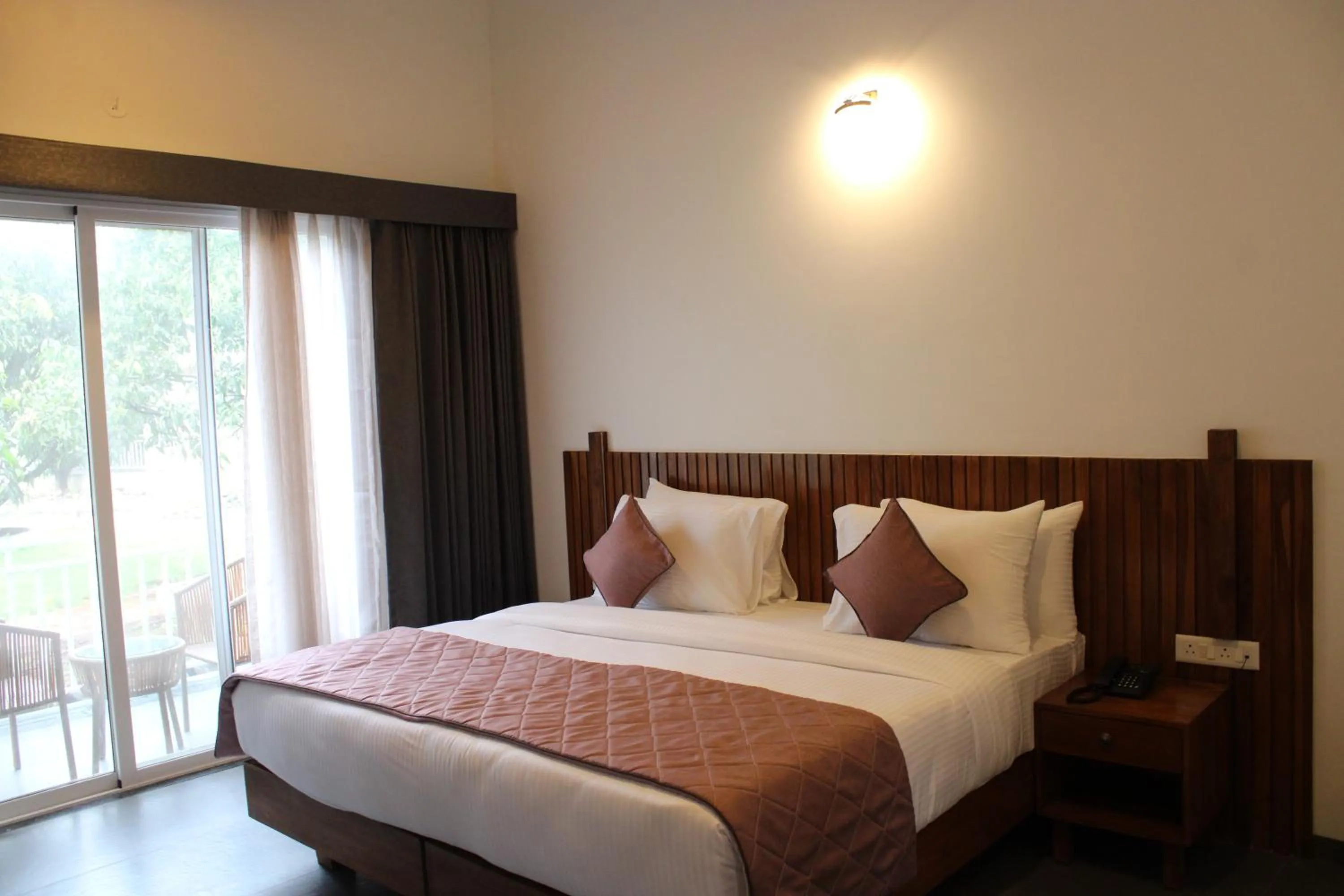 Bed in Mango Leaf Lake Resort