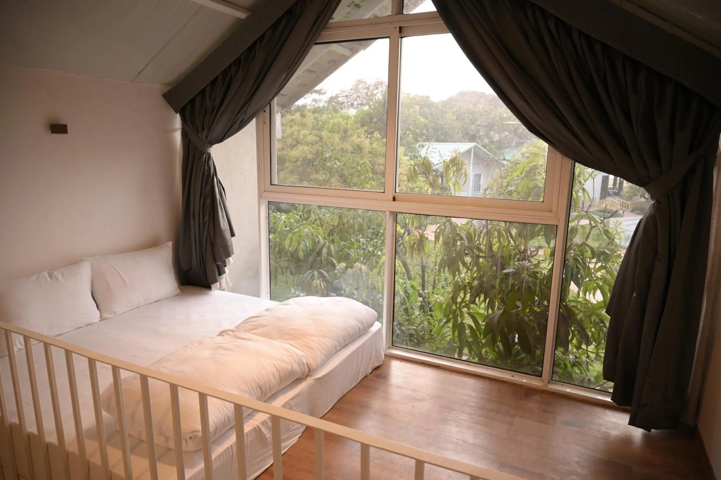 Garden view, Bed in Mango Leaf Lake Resort