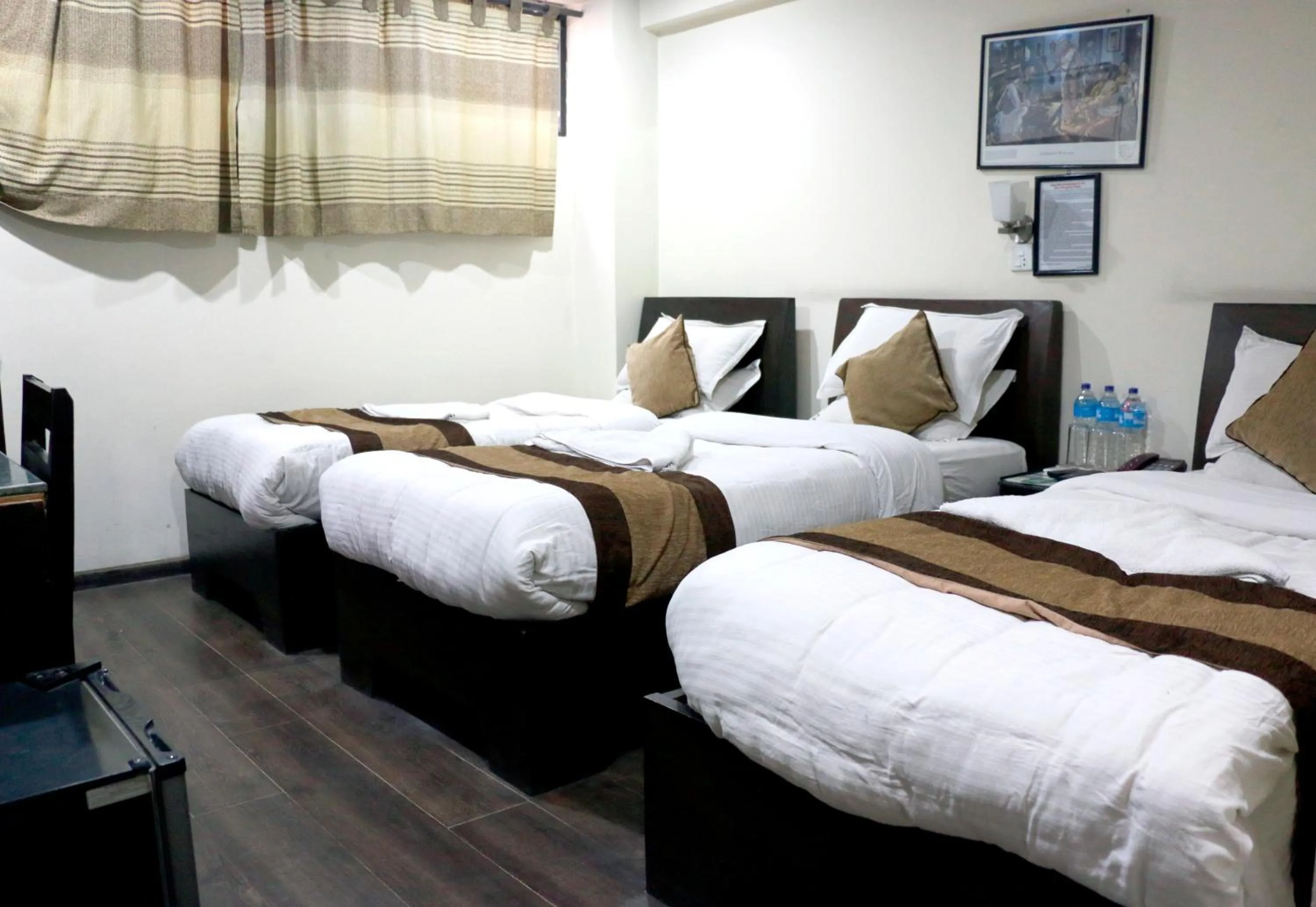 Bed in Alpine Hotel & Apartment