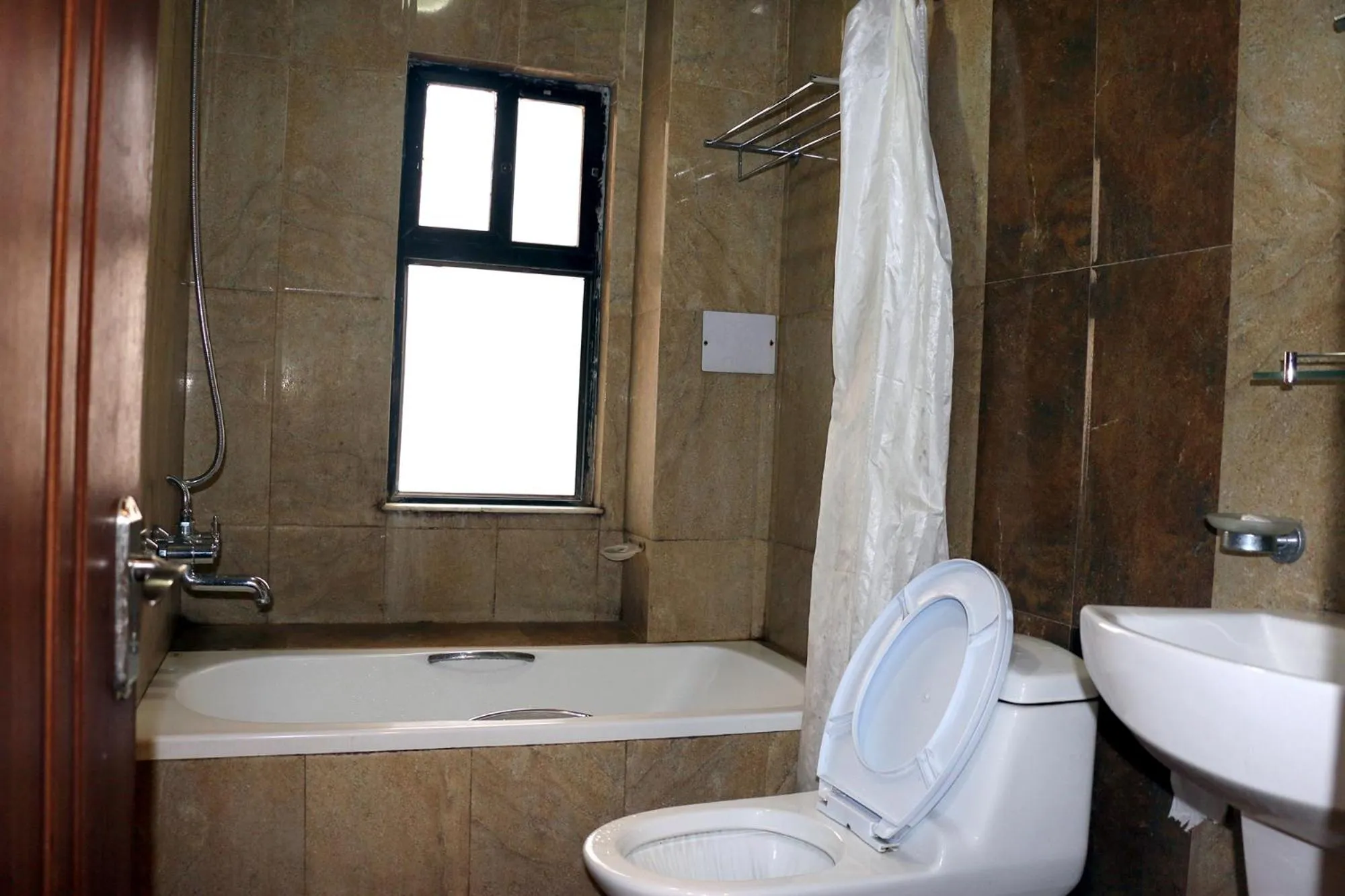 Bedroom in Alpine Hotel & Apartment