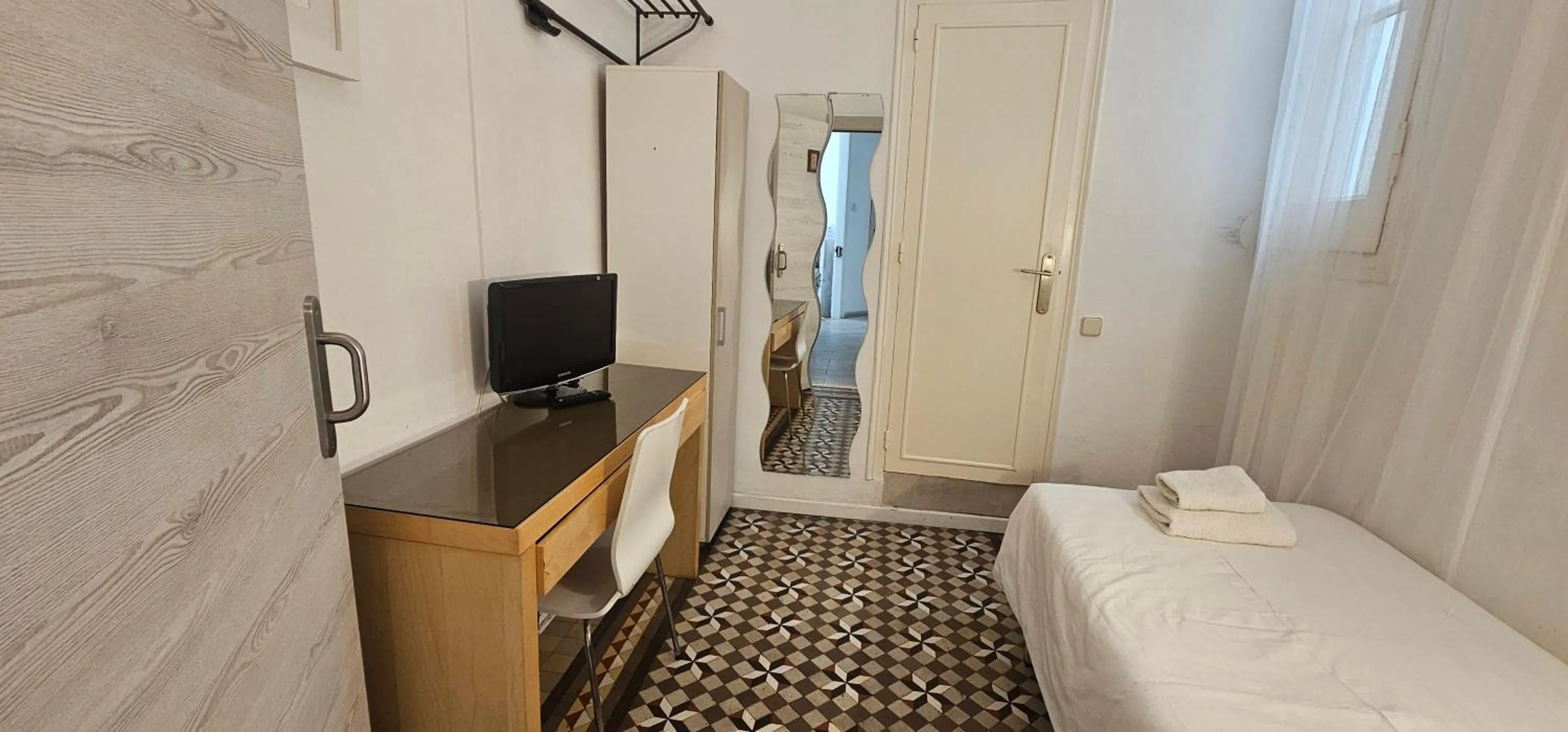 Photo of the whole room, Bed in Hostal Eixample