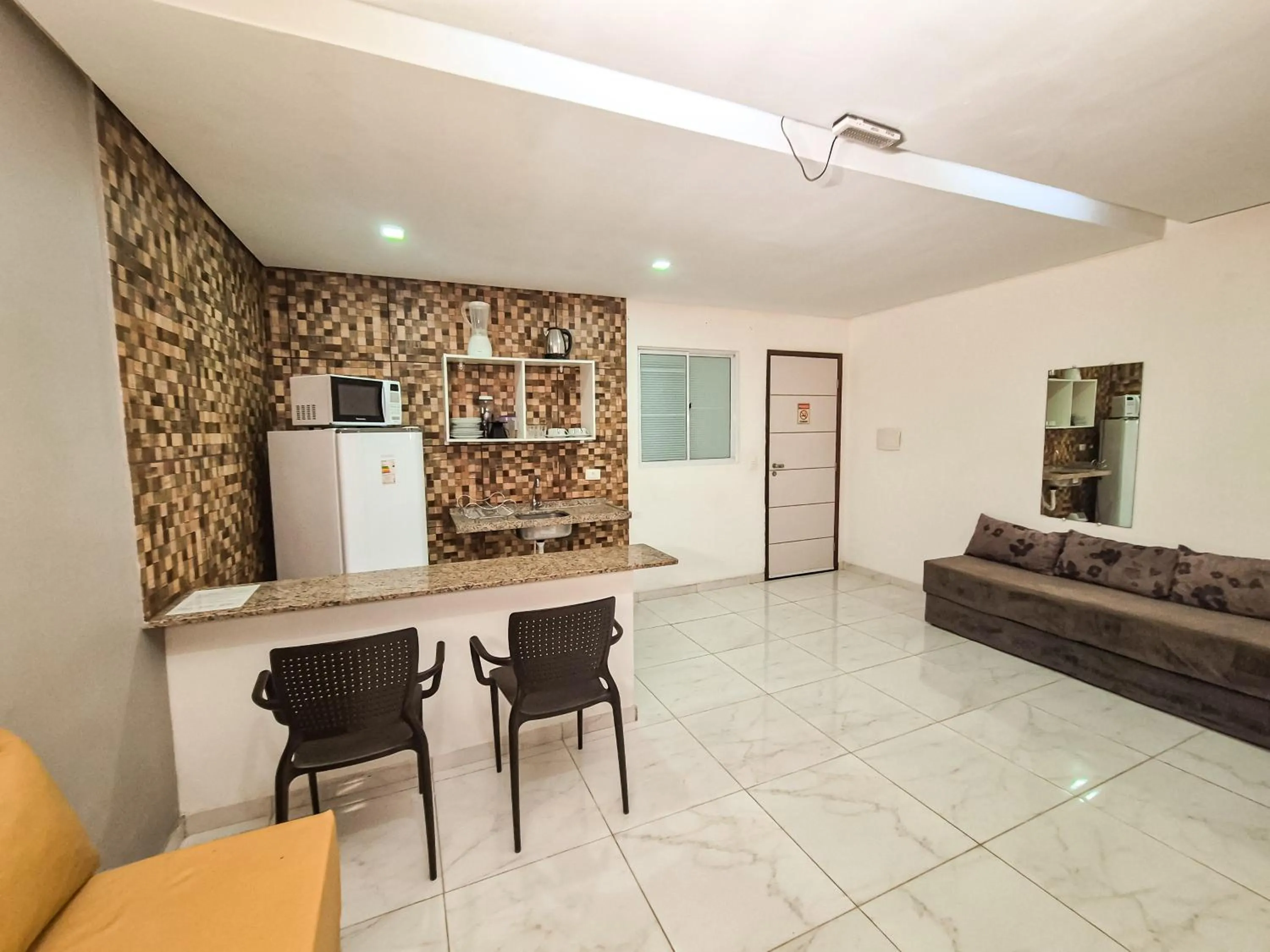 Kitchen or kitchenette in Pousada Cheiro do Mar