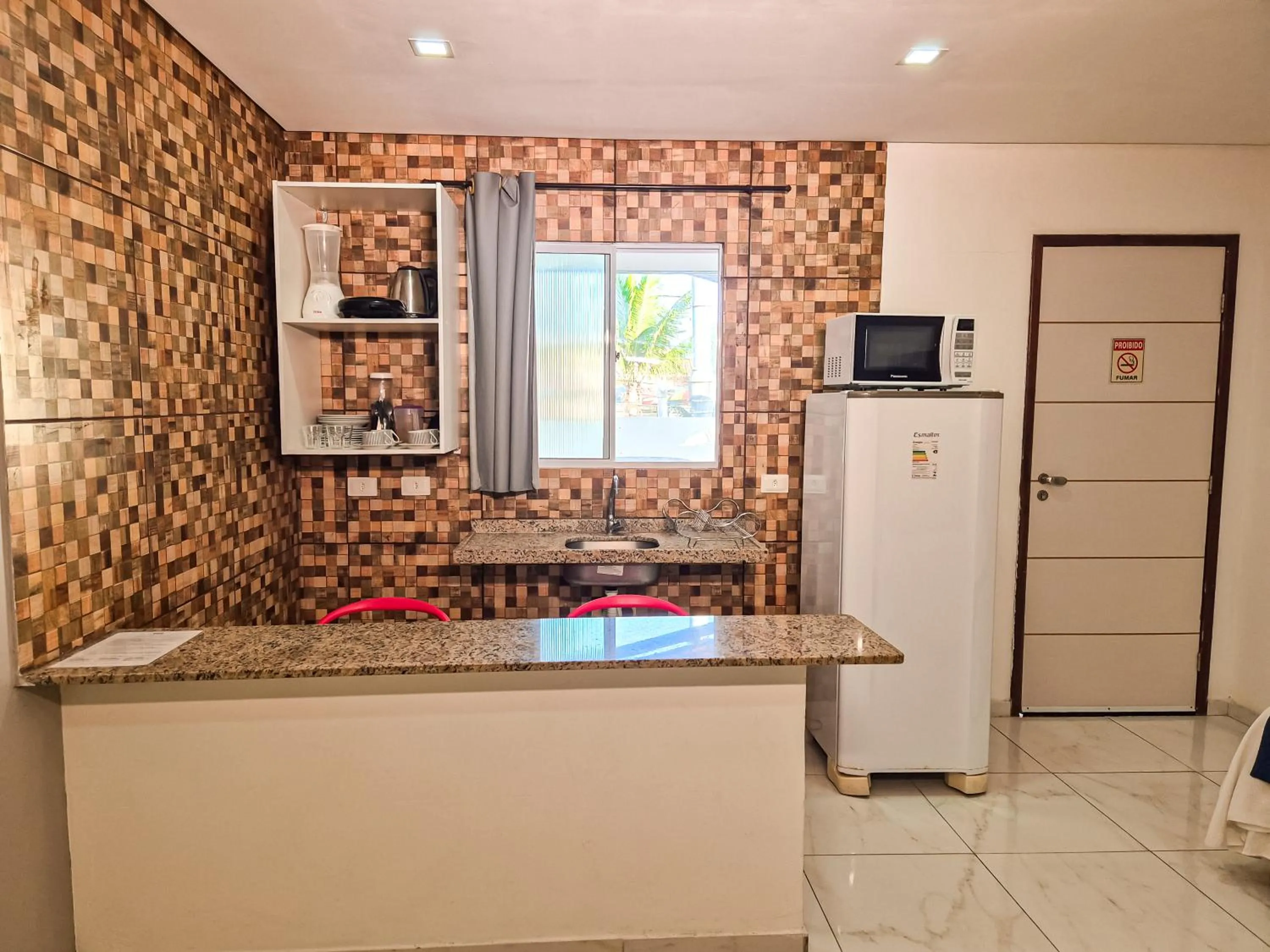 Kitchen or kitchenette in Pousada Cheiro do Mar