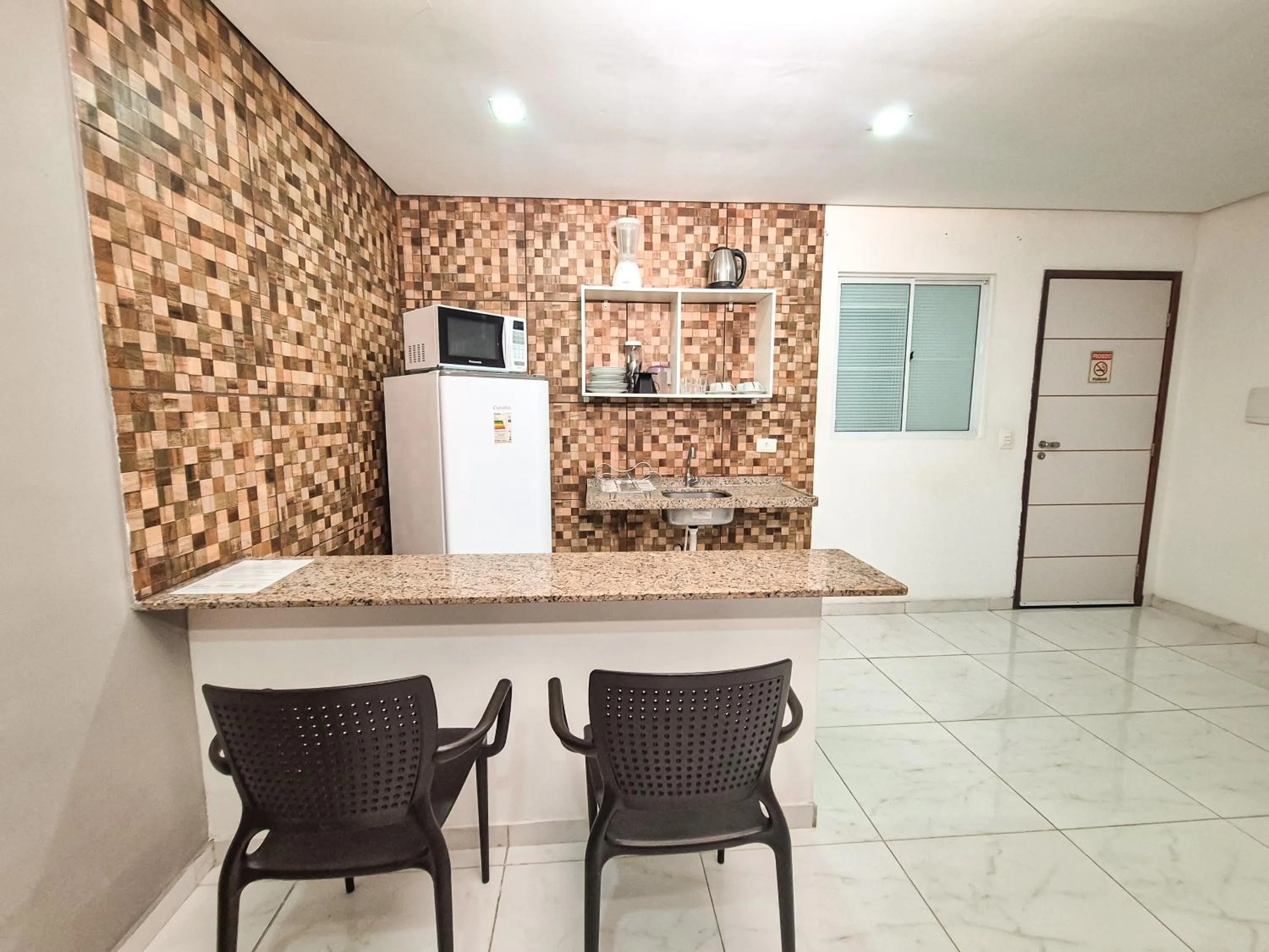 Kitchen or kitchenette in Pousada Cheiro do Mar