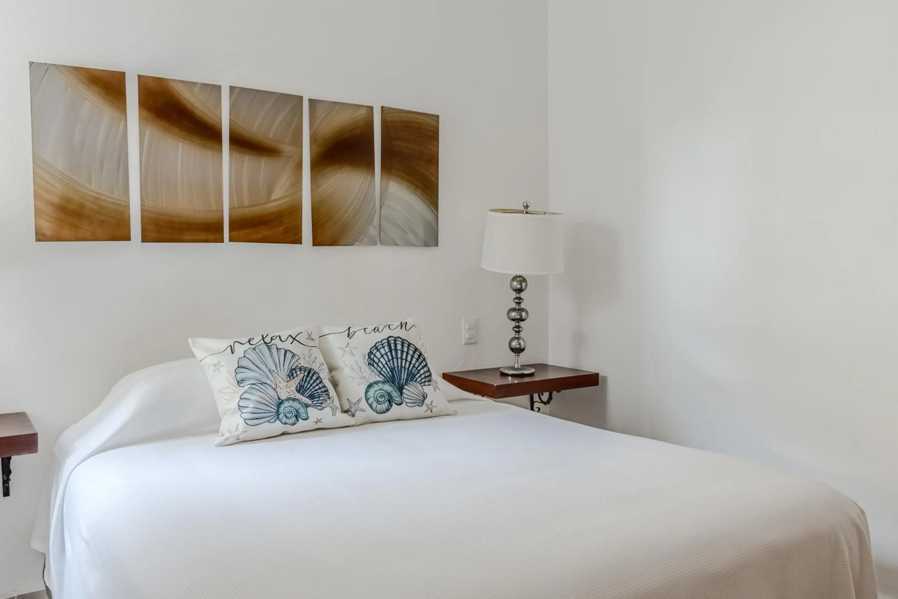 Bed in Vela's Condos Ocean Front