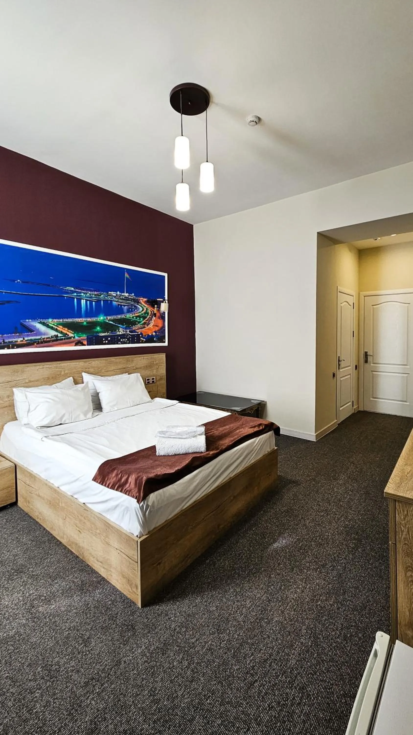 Bed in ELYSIUM HOTEL