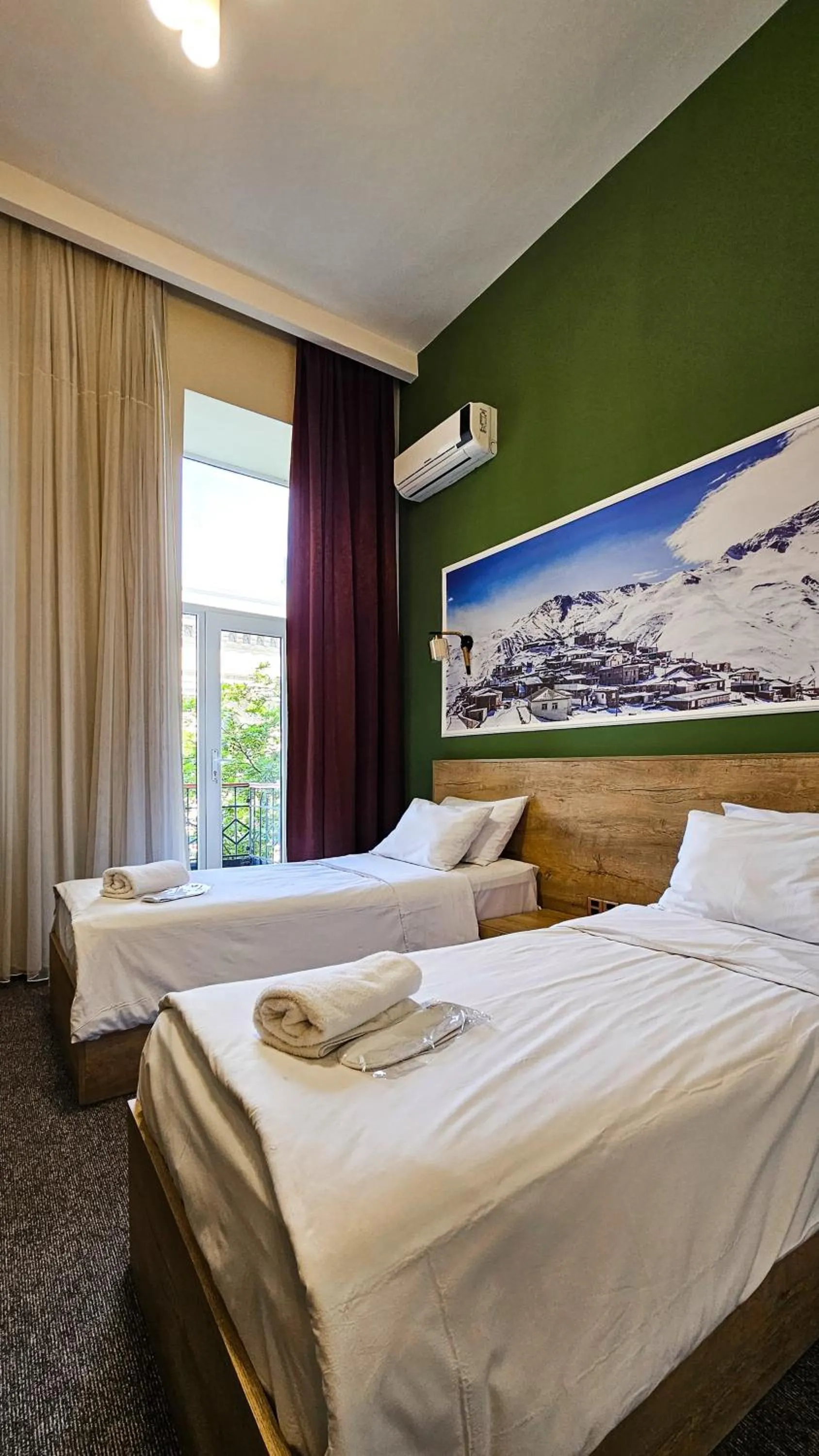 Bed in ELYSIUM HOTEL