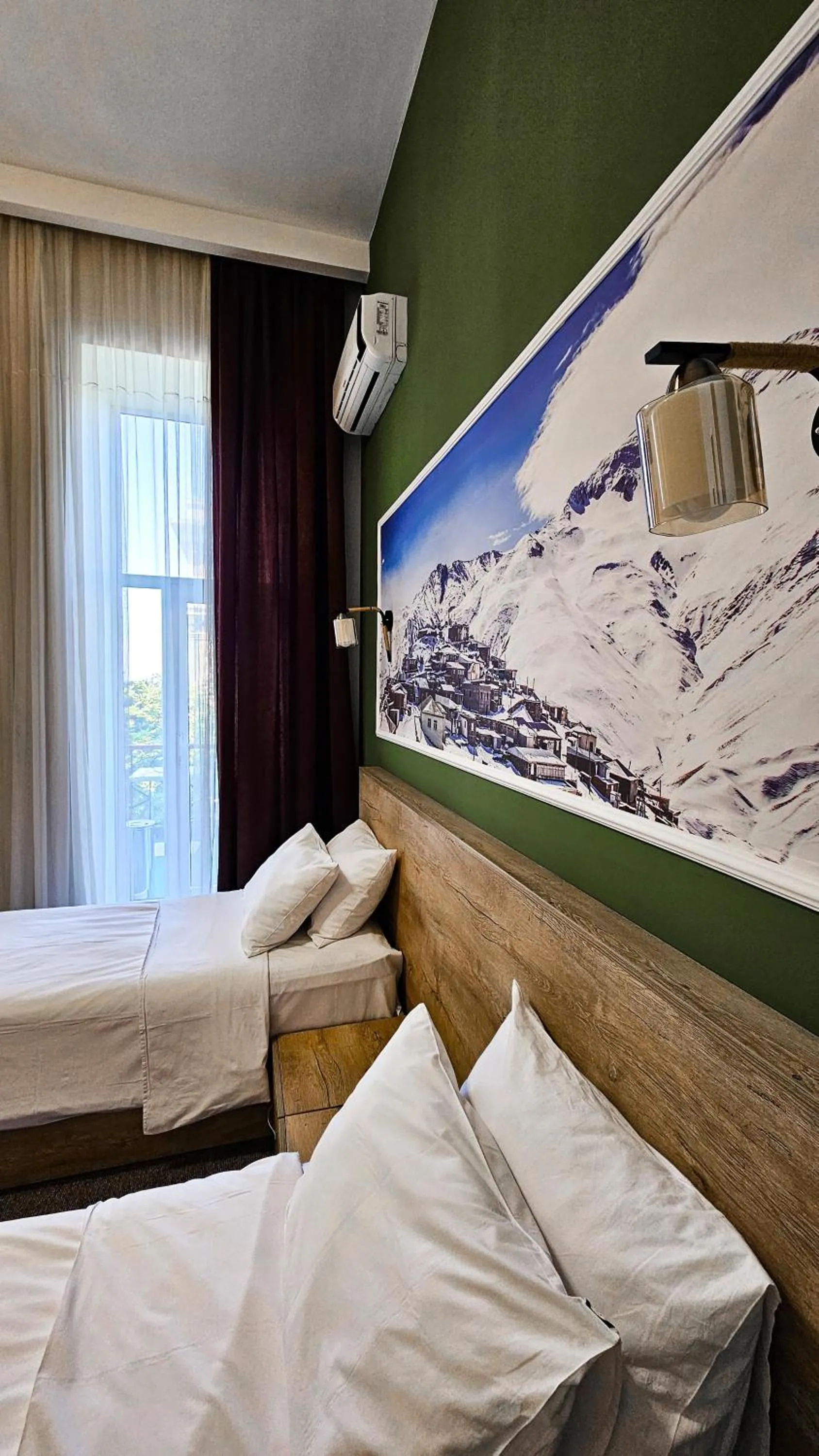 Bed in ELYSIUM HOTEL