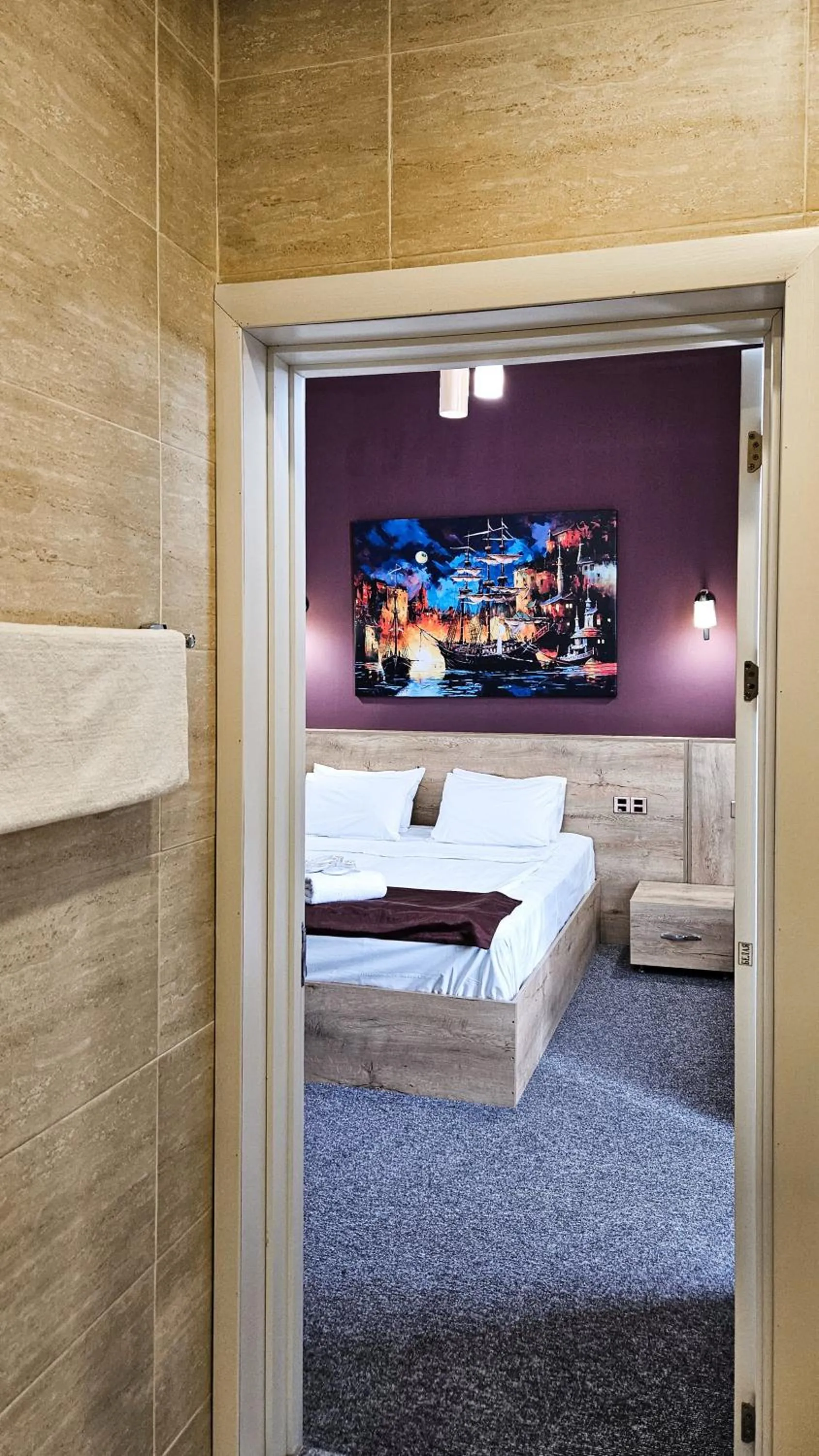 Bed in ELYSIUM HOTEL