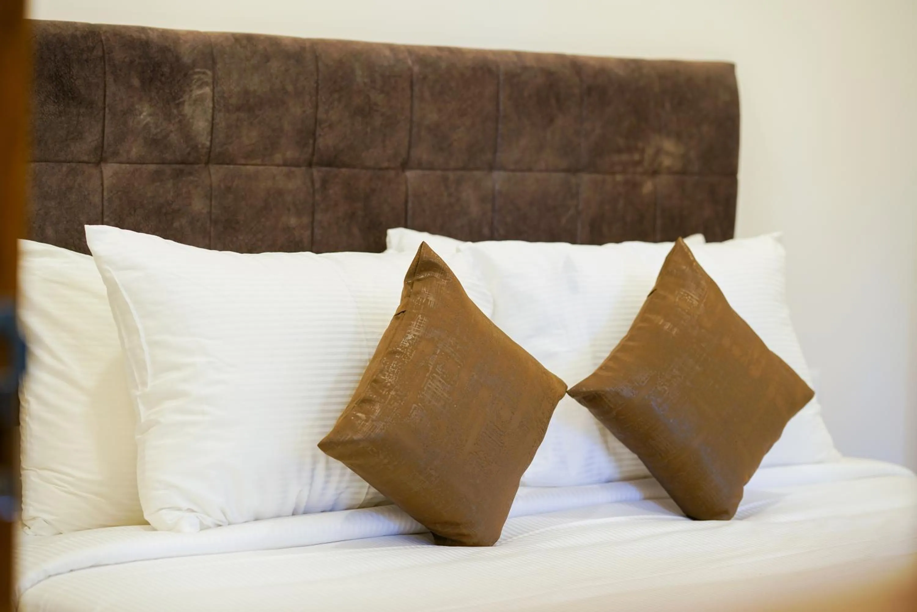 Bed in Grand Plaza Inn