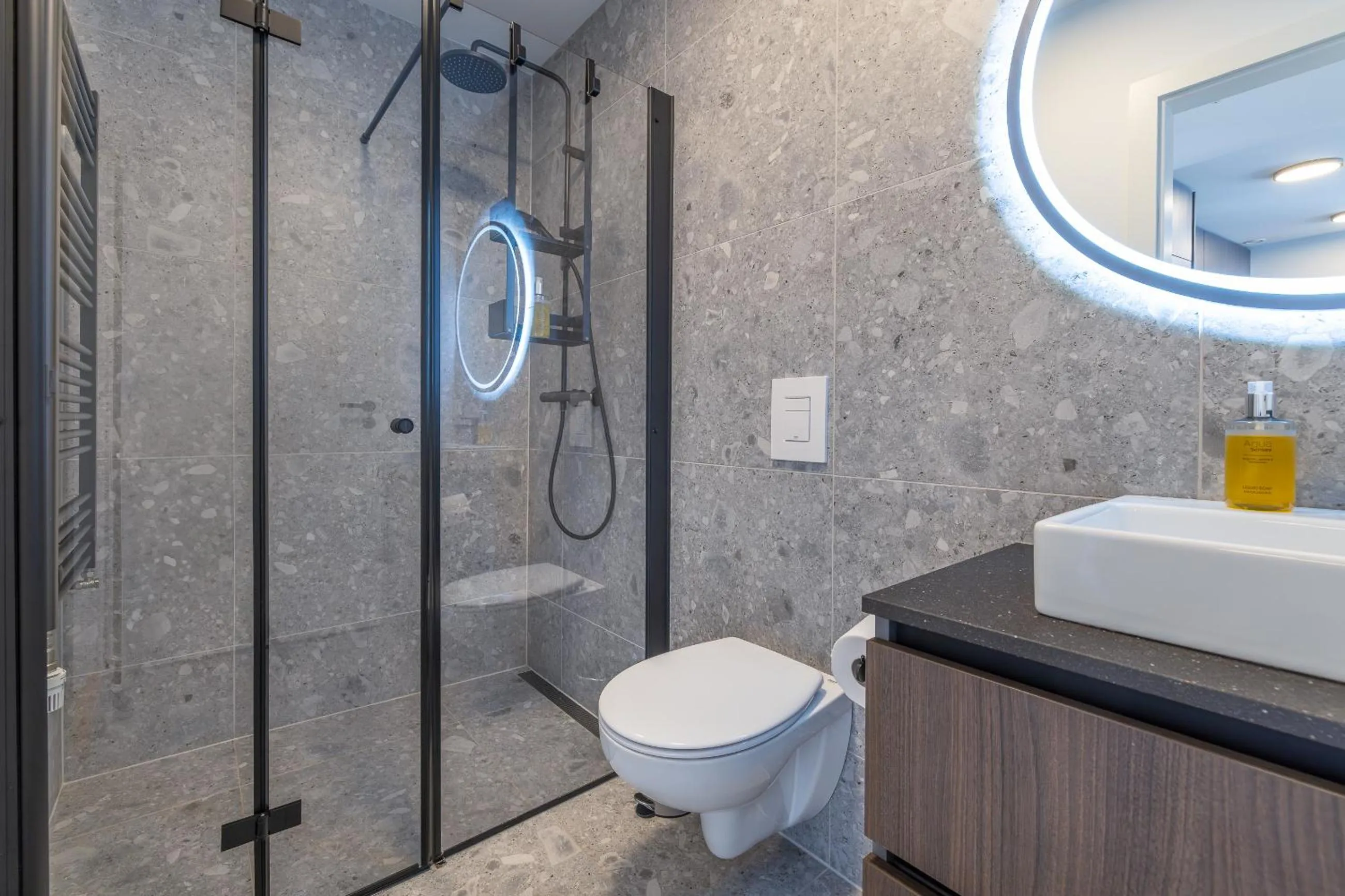 Shower in Hlemmur Suites