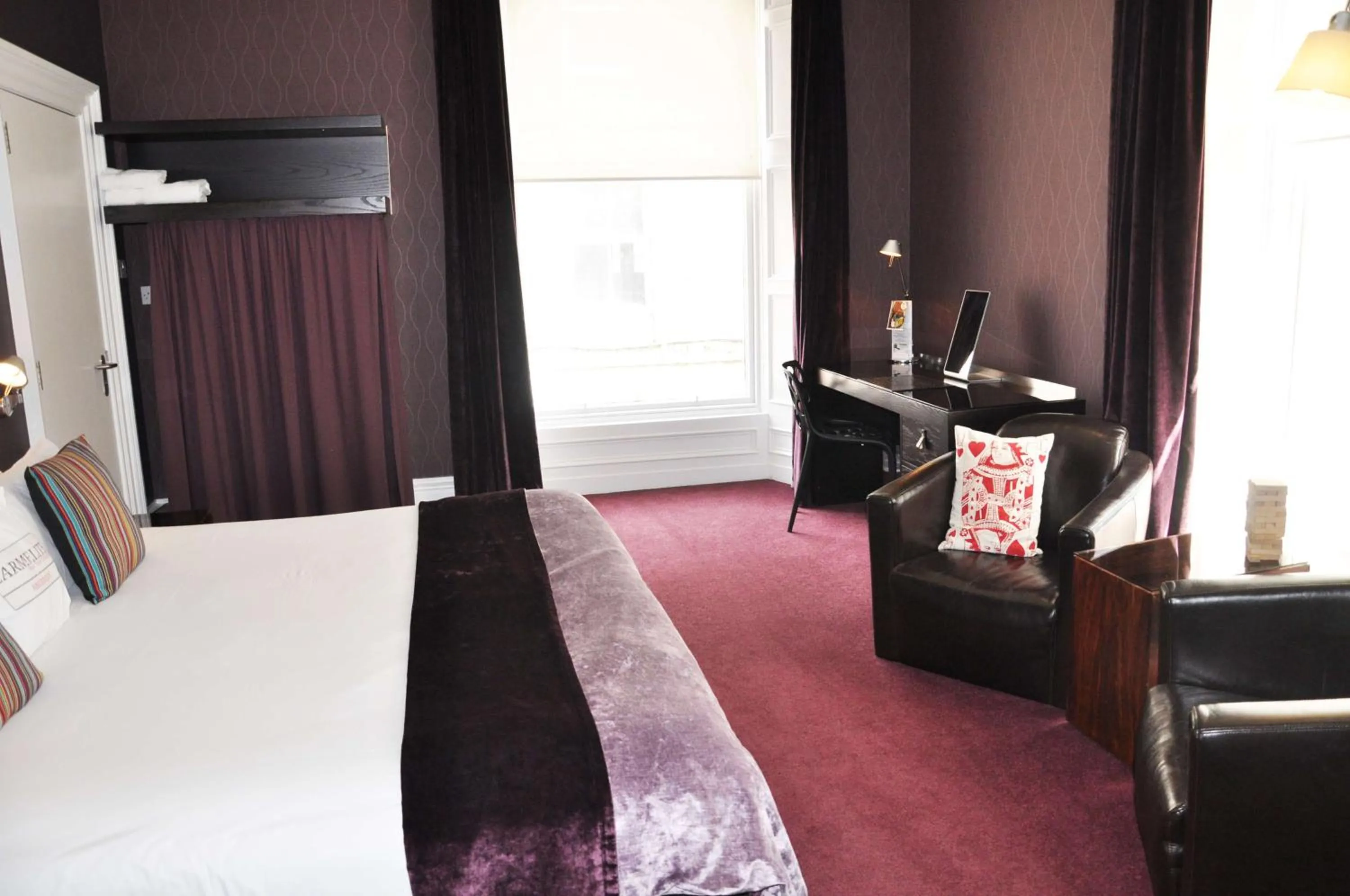 Bedroom, Seating Area in Carmelite Hotel; BW Signature Collection