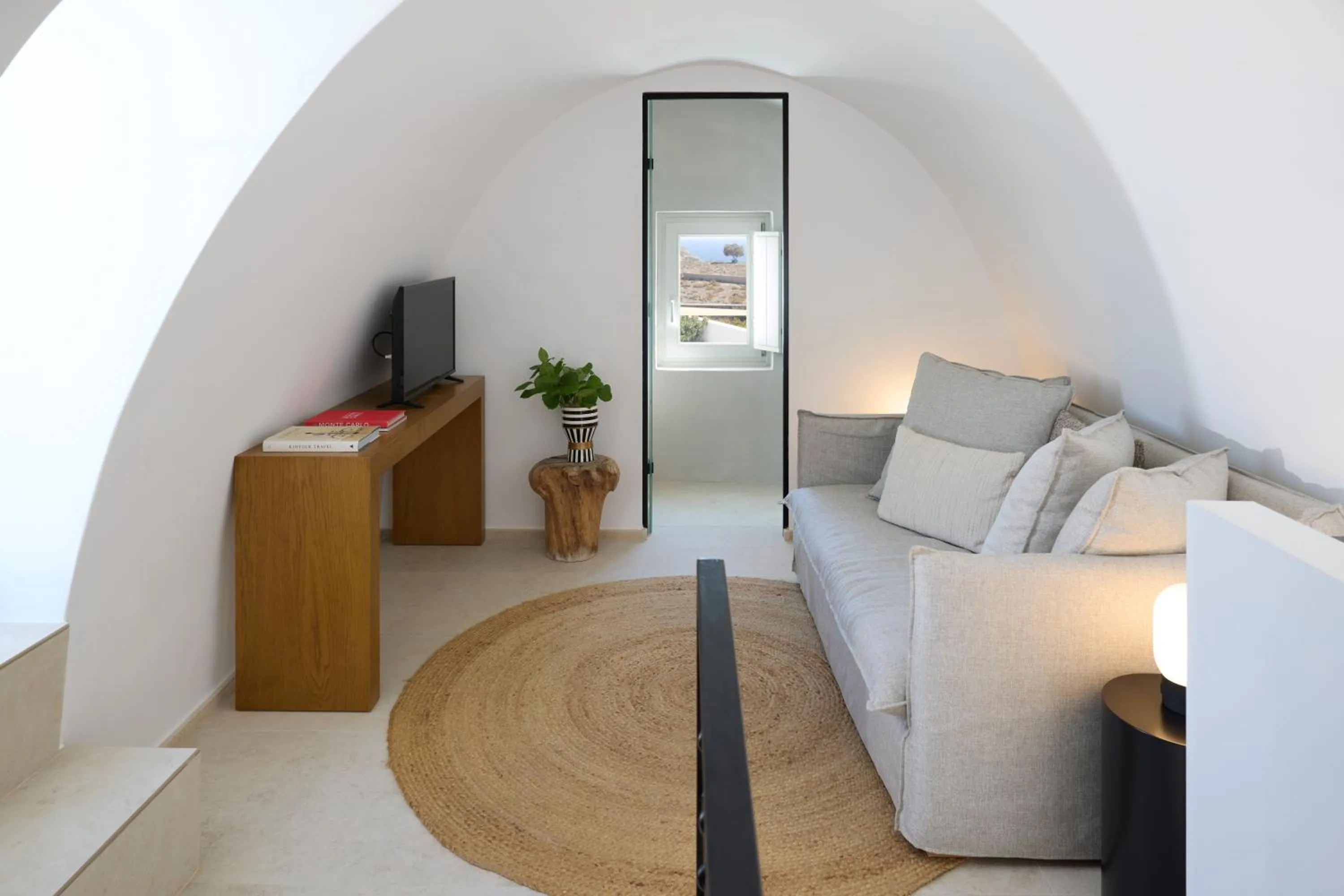 Communal lounge/ TV room in Omna Caldera Suites