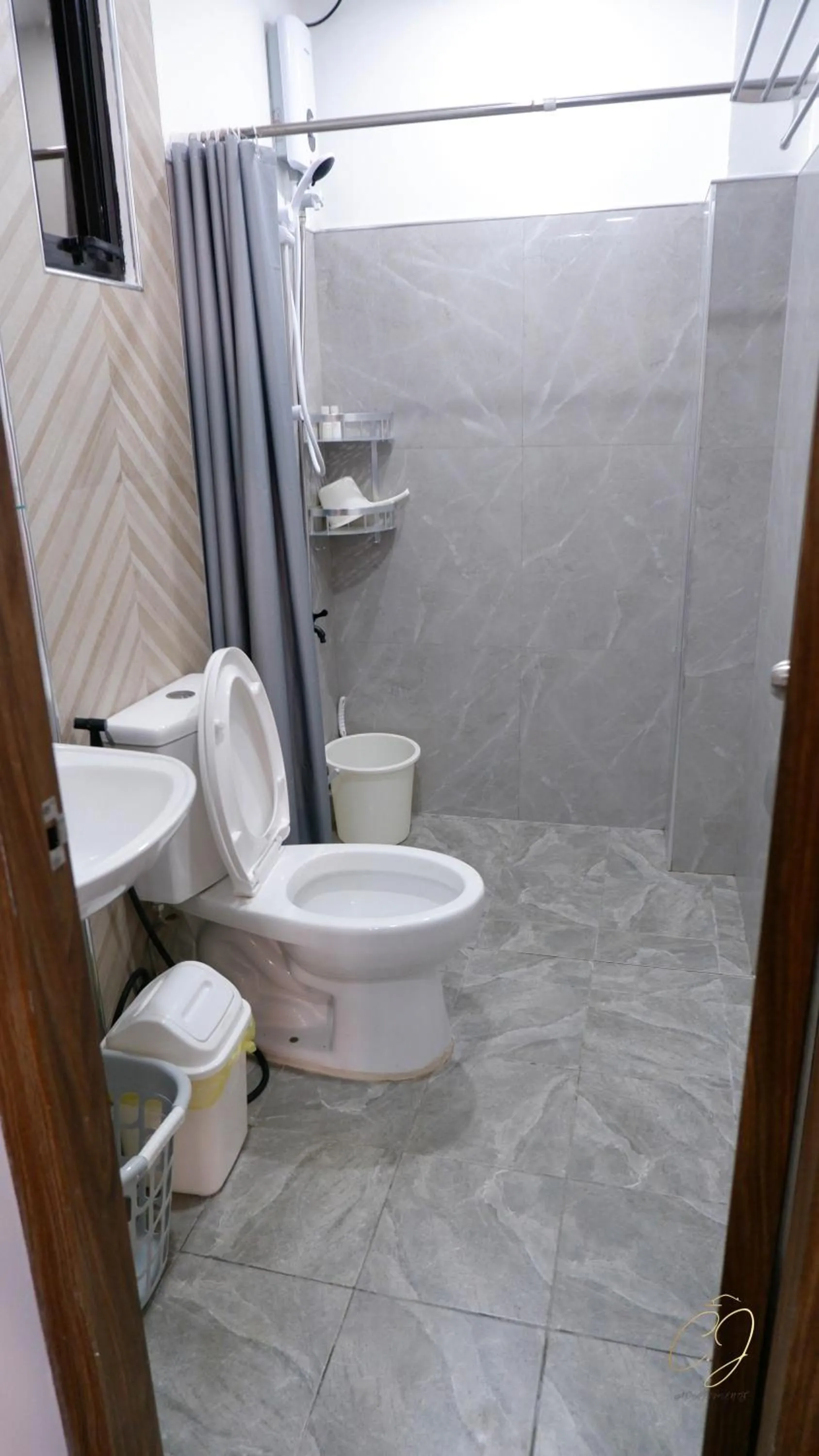 Toilet in CJ Apartments