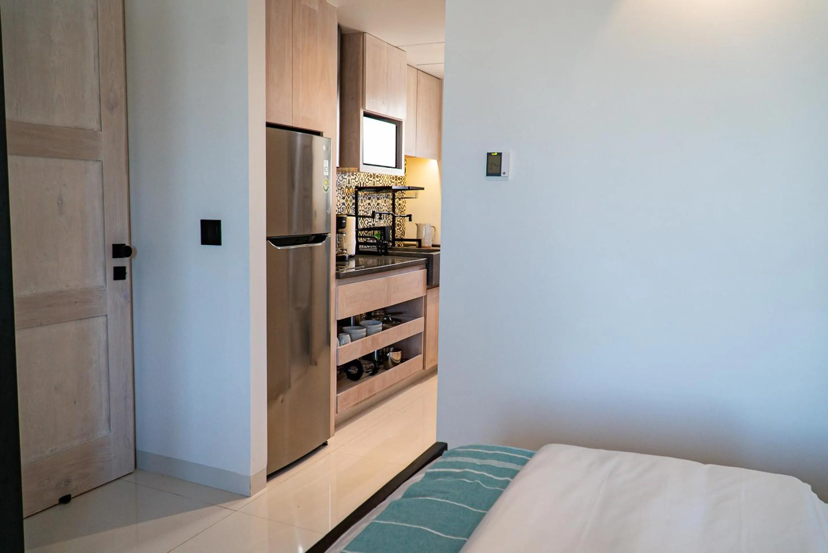 Kitchen or kitchenette, Bed in Flamboyan Hotel & Residences