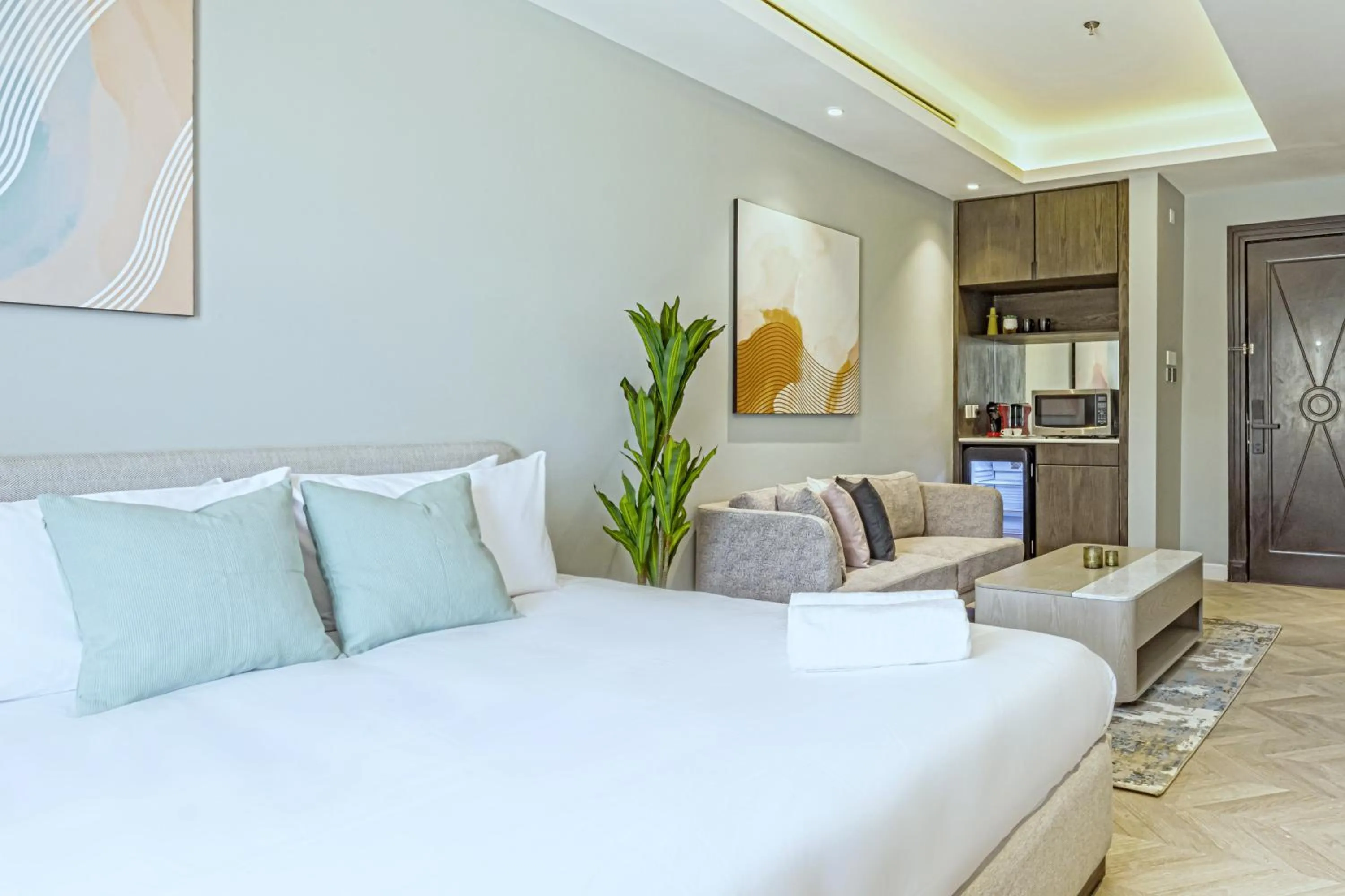 Seating area, Bed in Stella Stays Olaya Tower 1