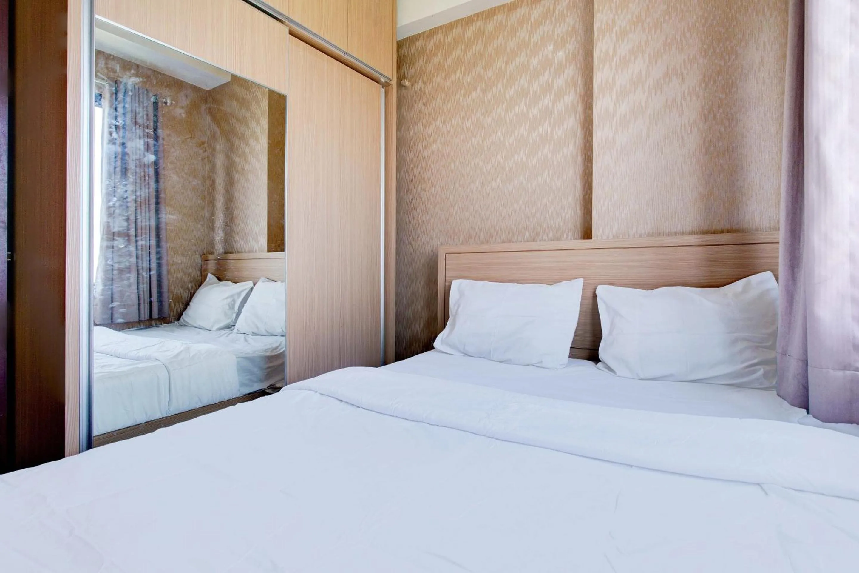 Bedroom, Bed in OYO Life 93310 Apartemen Tamansari Panoramic By Santuy 2