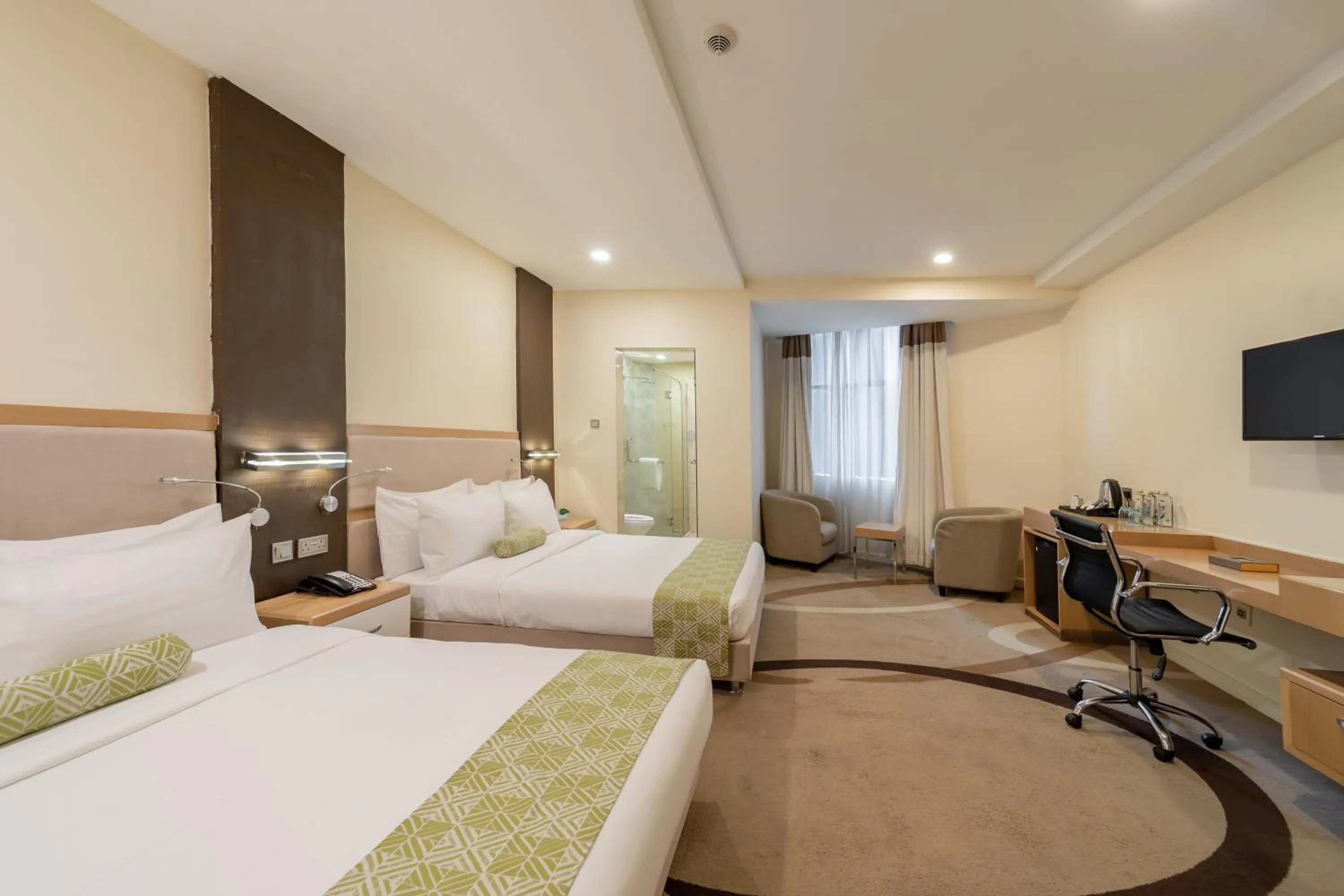 Communal lounge/ TV room, Bed in PrideInn Azure Hotel Nairobi Westlands