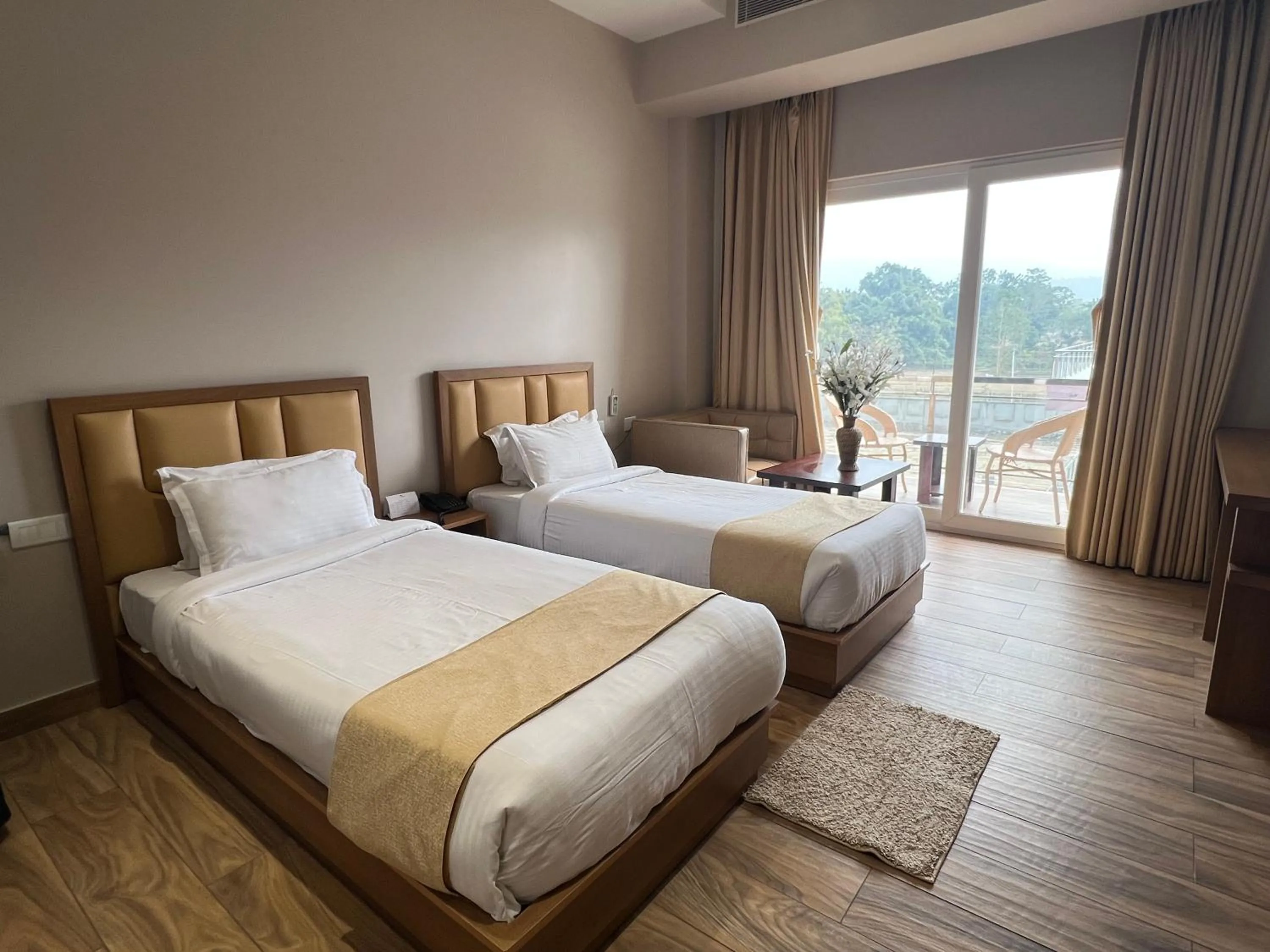 Bed in Finn's Weaver Resort, Kaziranga