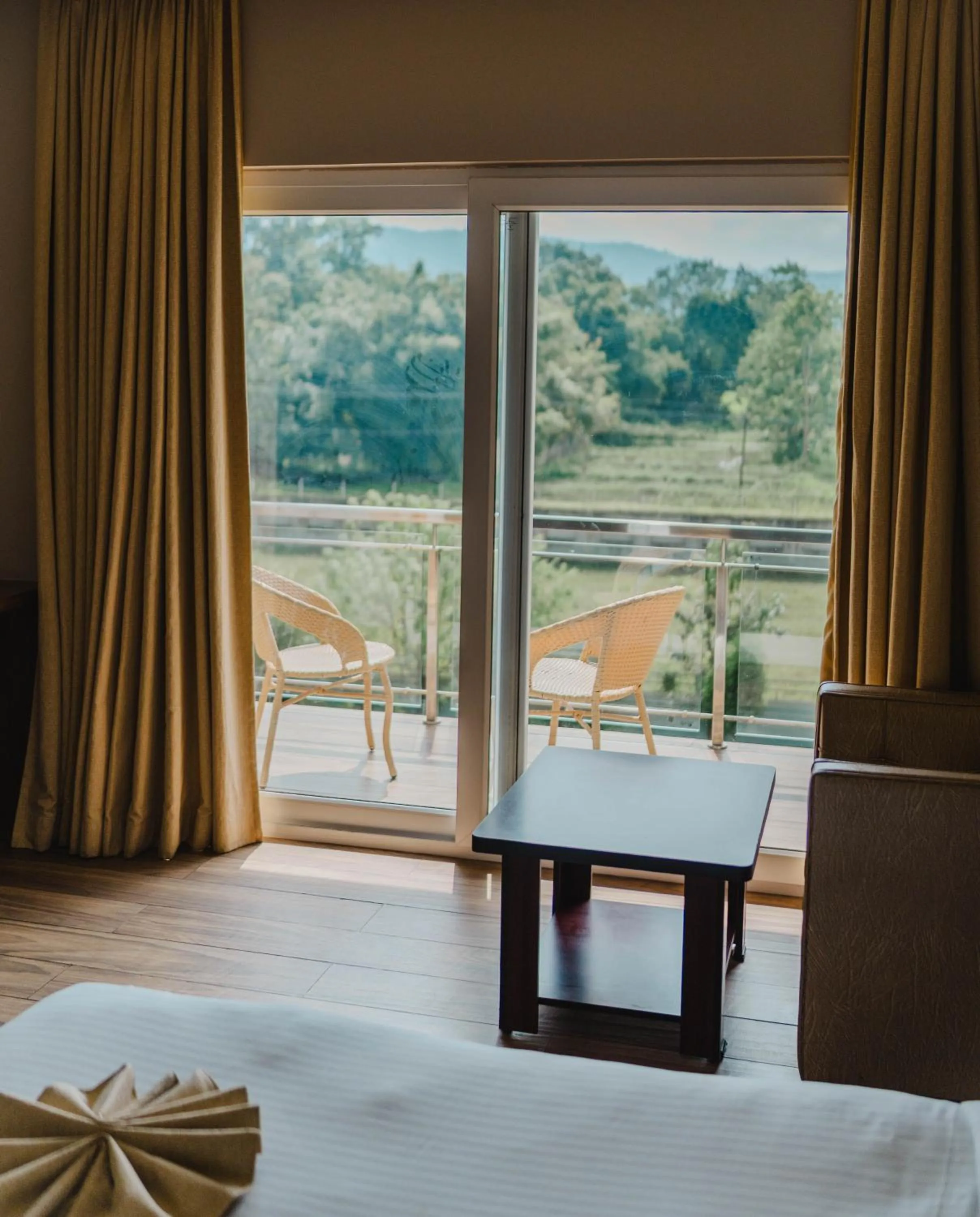 Seating area, Bed in Finn's Weaver Resort, Kaziranga