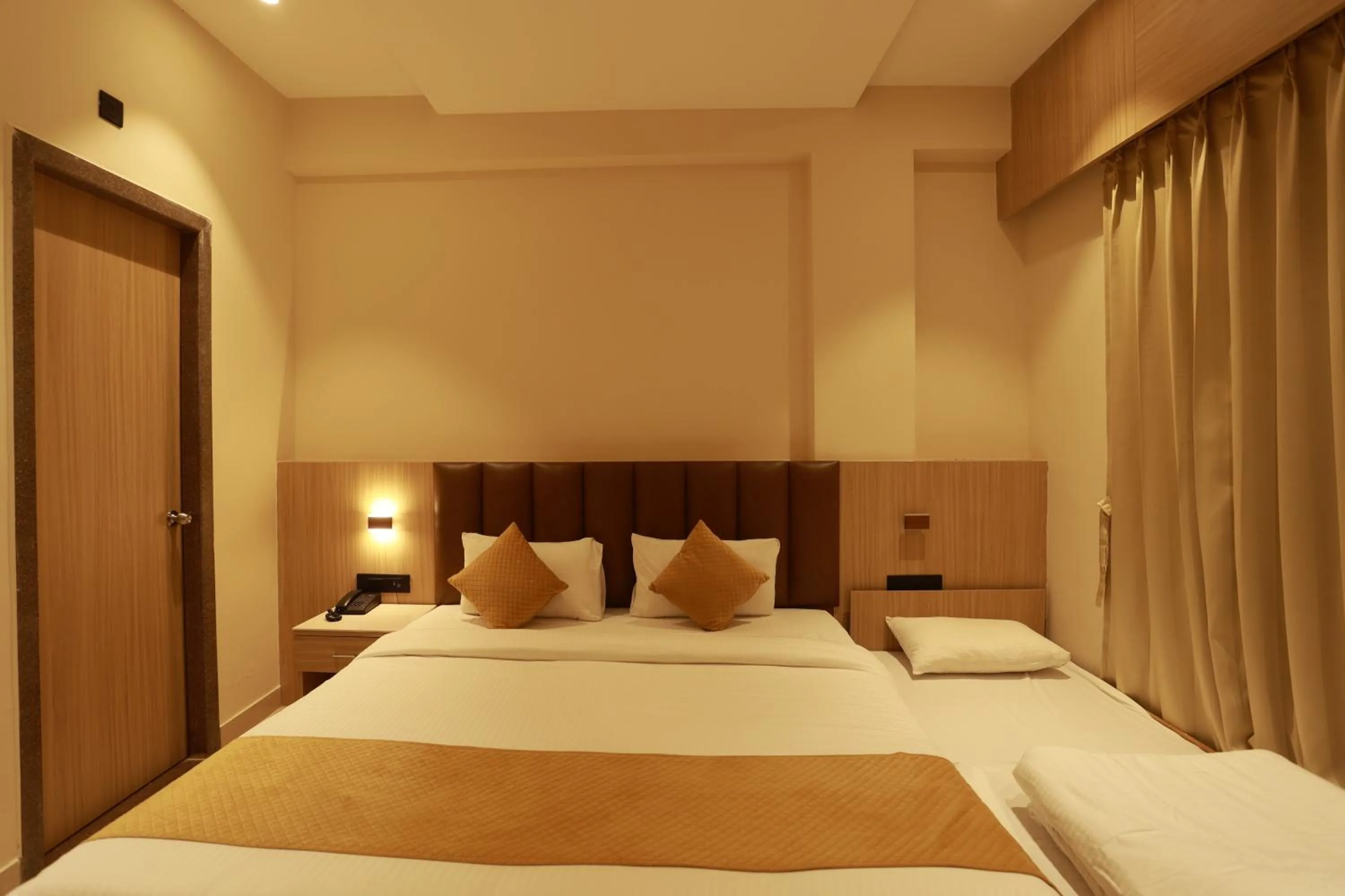 Bed in Hotel Taviral Regency