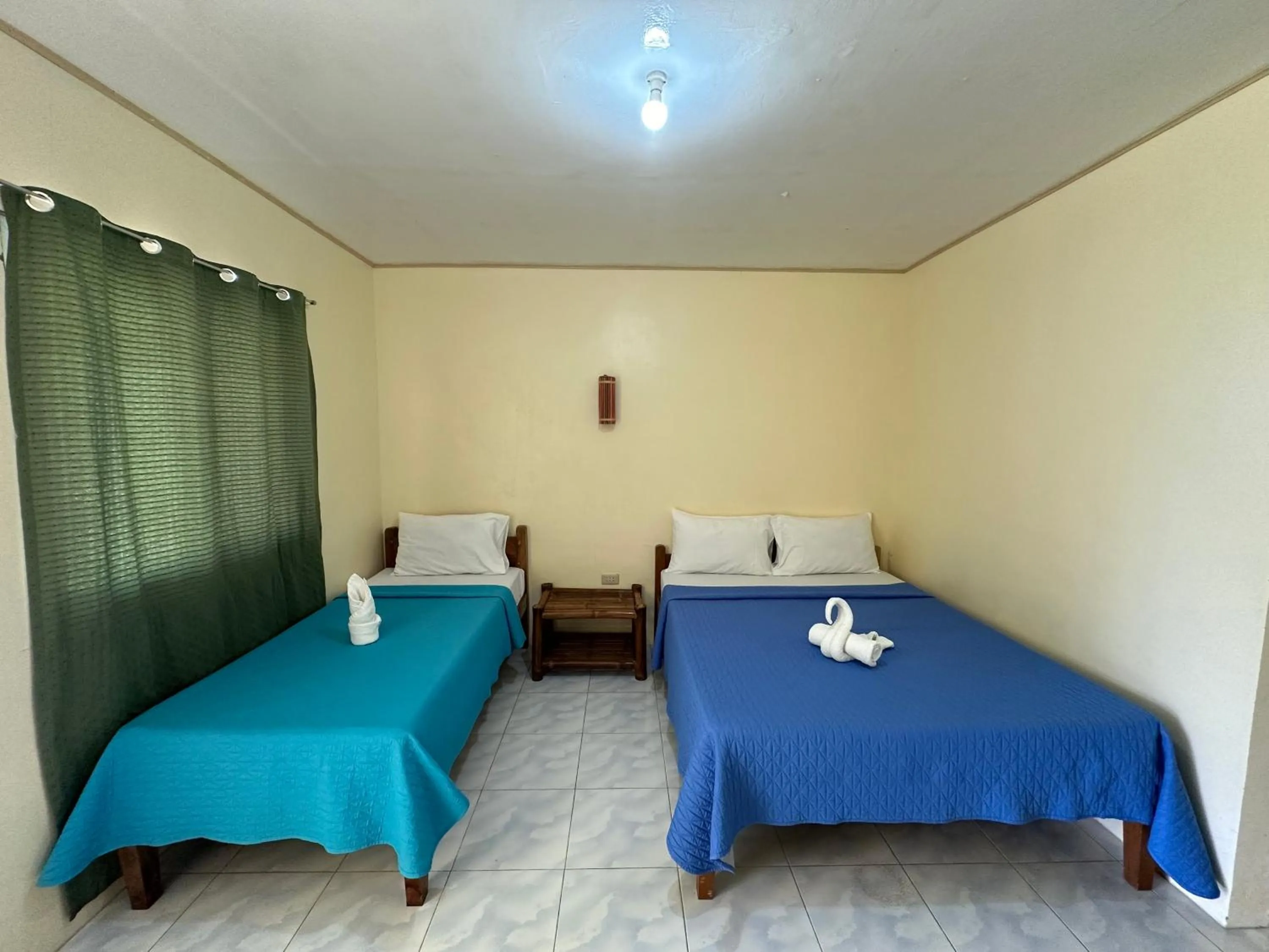 Bed in Dancalan Beach Resort