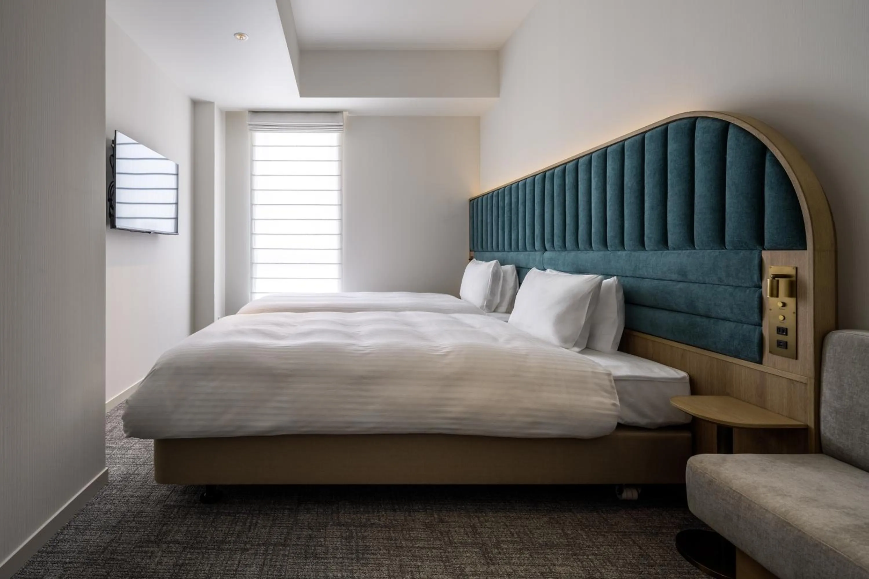 Bed in Hotel Comento Yokohama Kannai