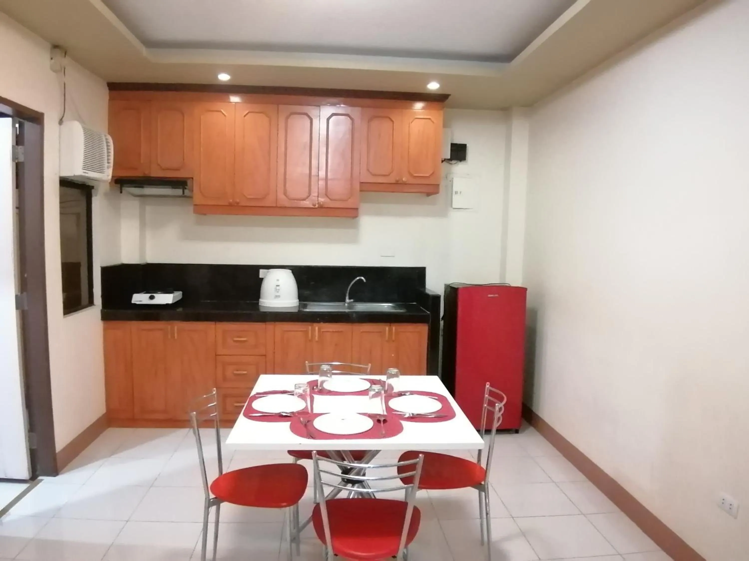 Kitchen or kitchenette in Manora Apartment