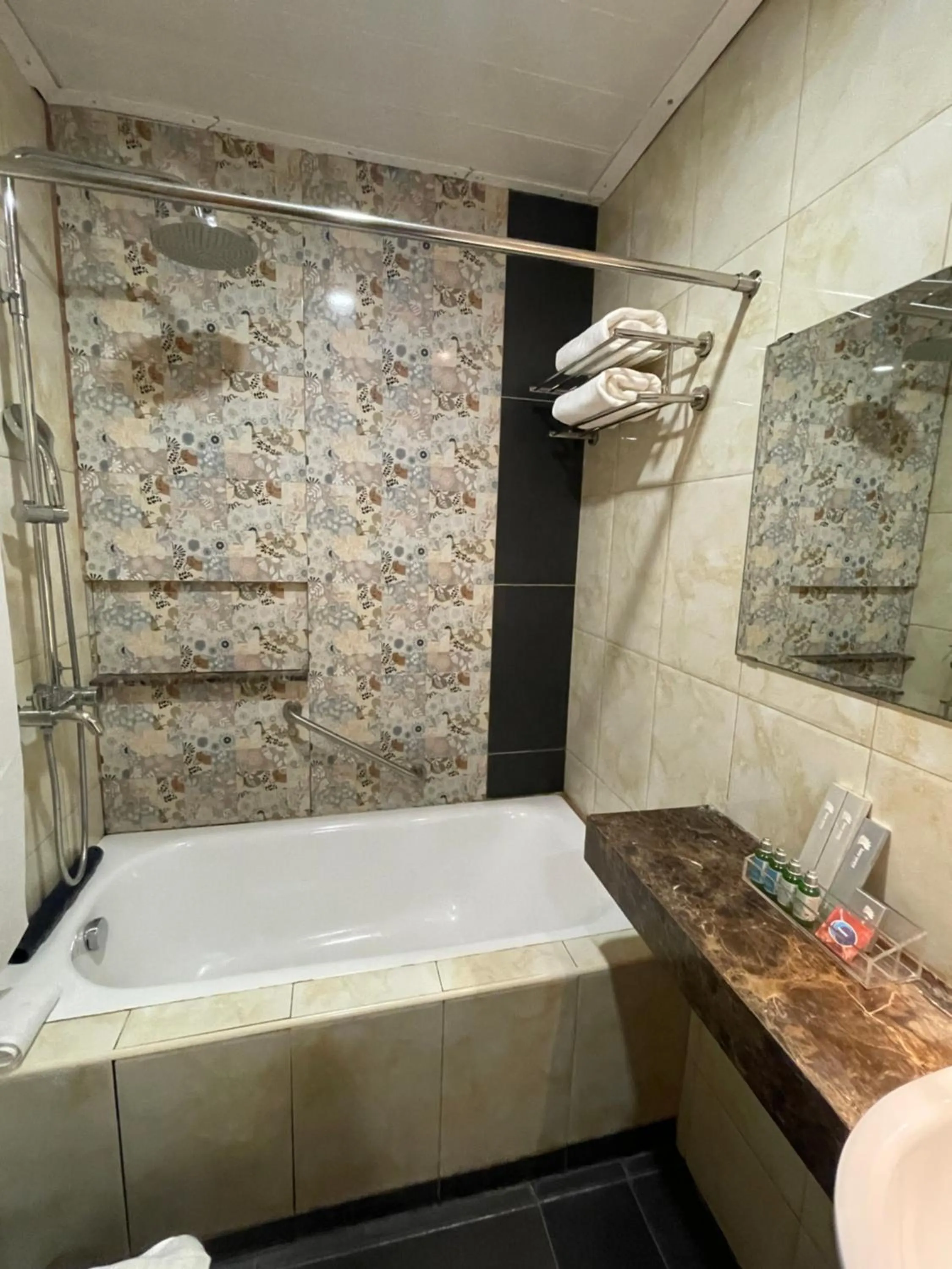 Shower in Homes at Bay Area Suites by SMS Hospitality