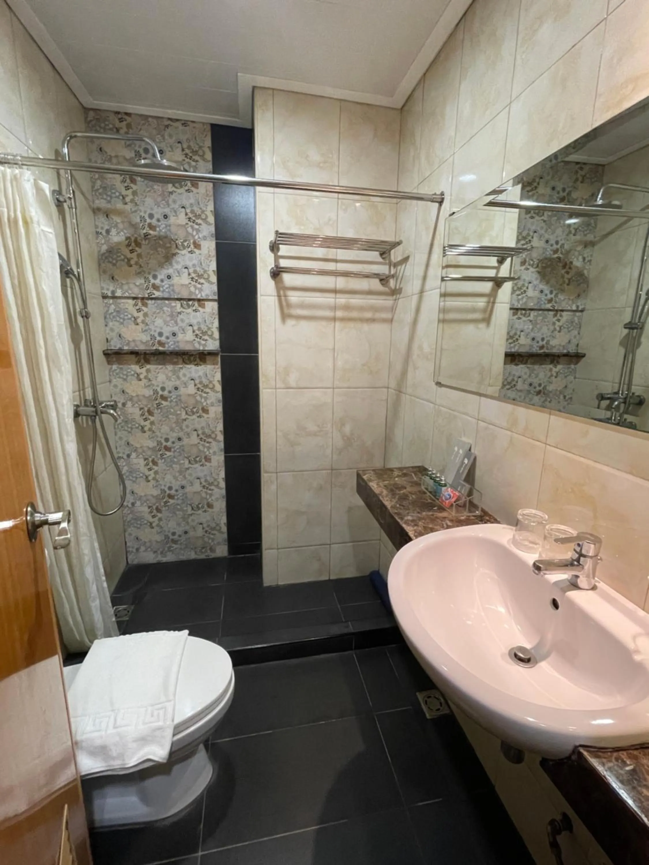 Shower in Homes at Bay Area Suites by SMS Hospitality