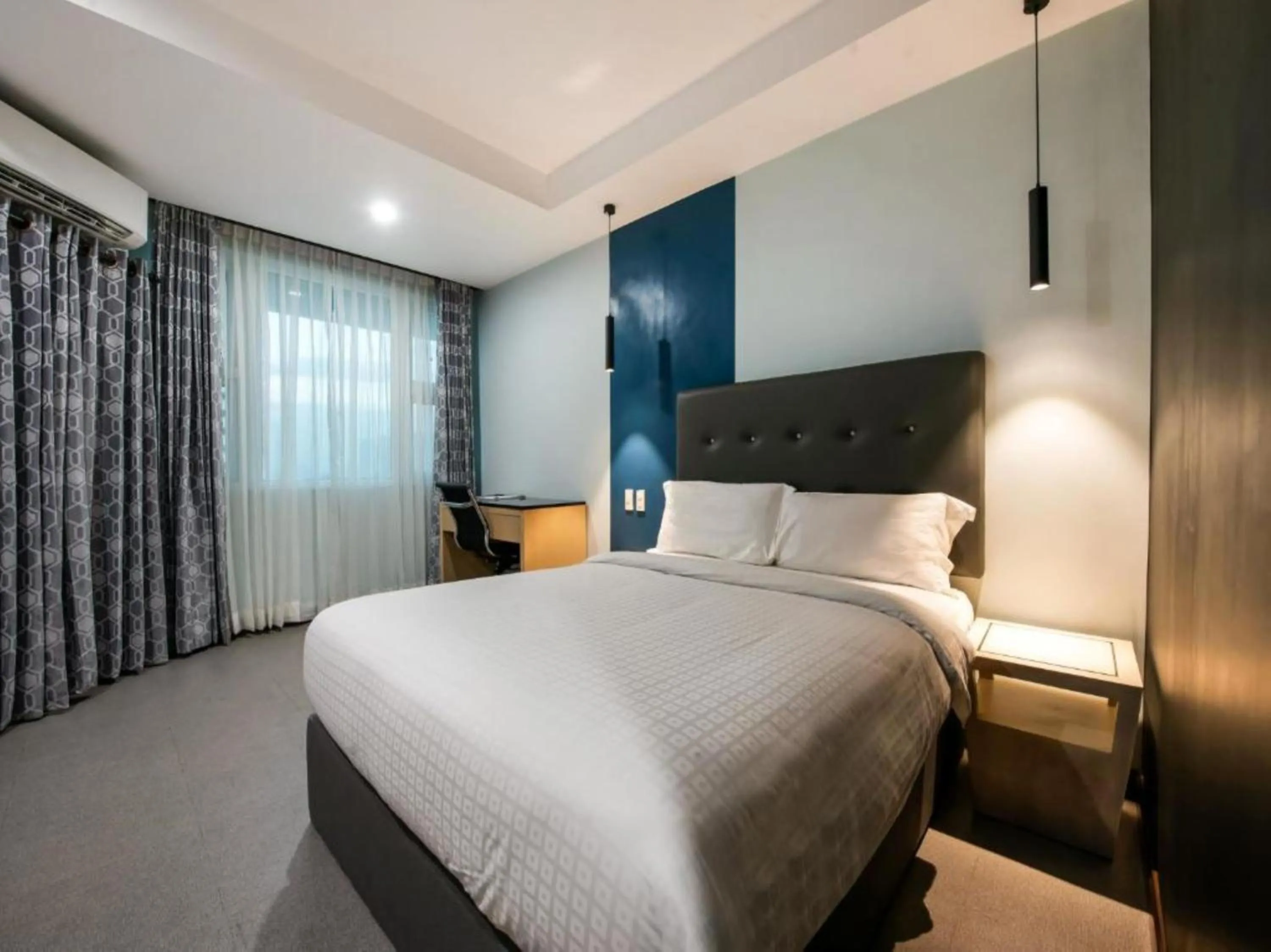 Bed in Homes at Bay Area Suites by SMS Hospitality