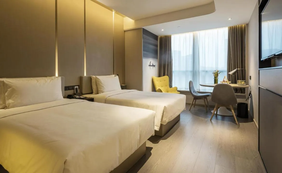 Bed in Atour Hotel Hangzhou Binjiang Olympic Sports