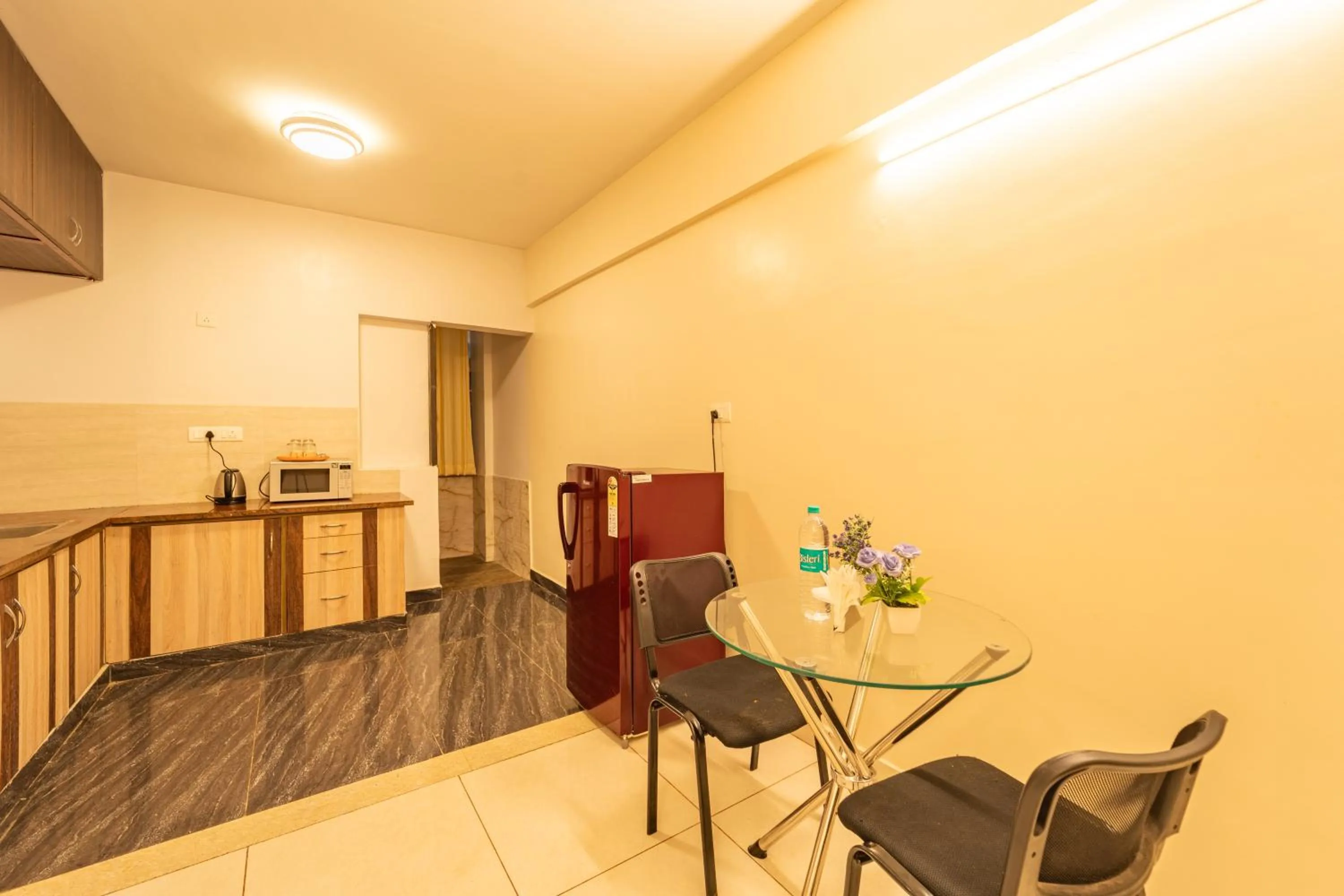 Kitchen or kitchenette in The Suites