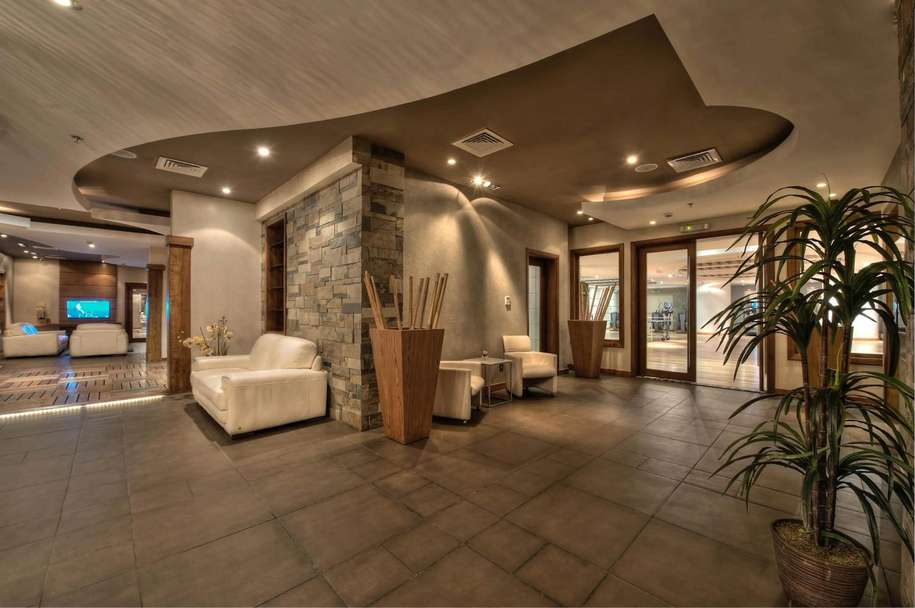 Fitness centre/facilities, Lobby/Reception in Al Rawasi Hotel Suites