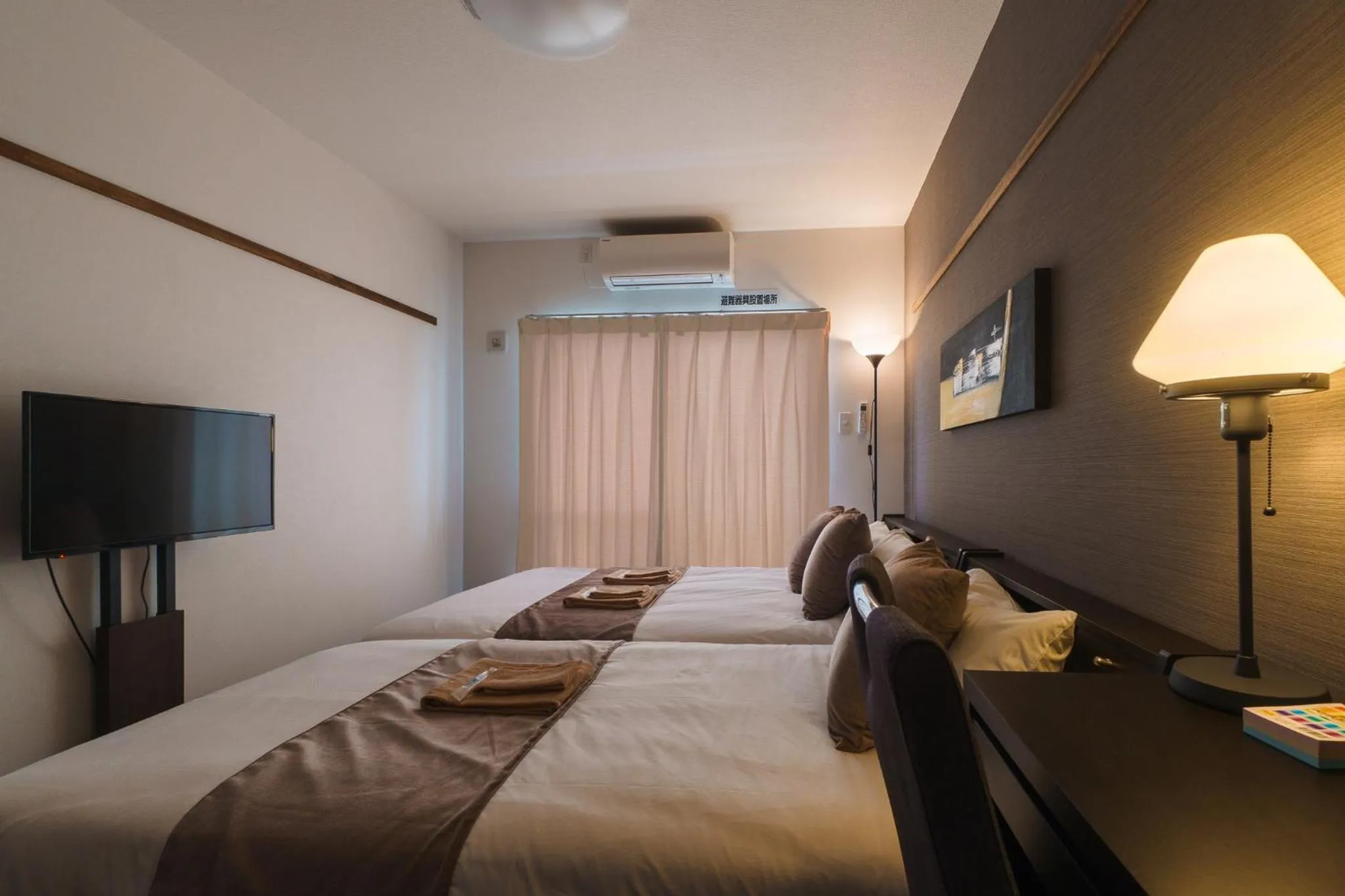 Bed in KINTARO Hotel Okinawa Naha