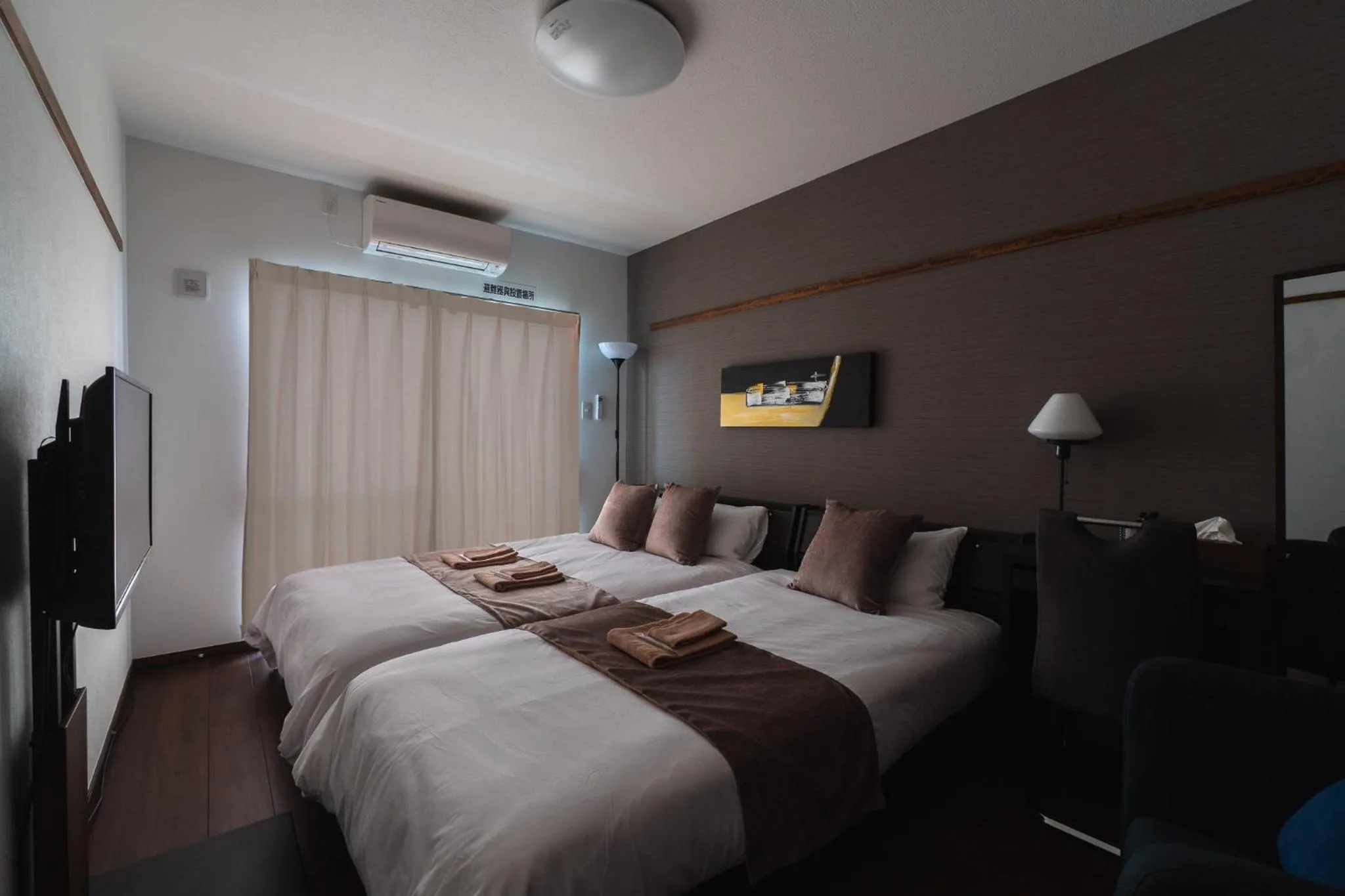 Bed in KINTARO Hotel Okinawa Naha