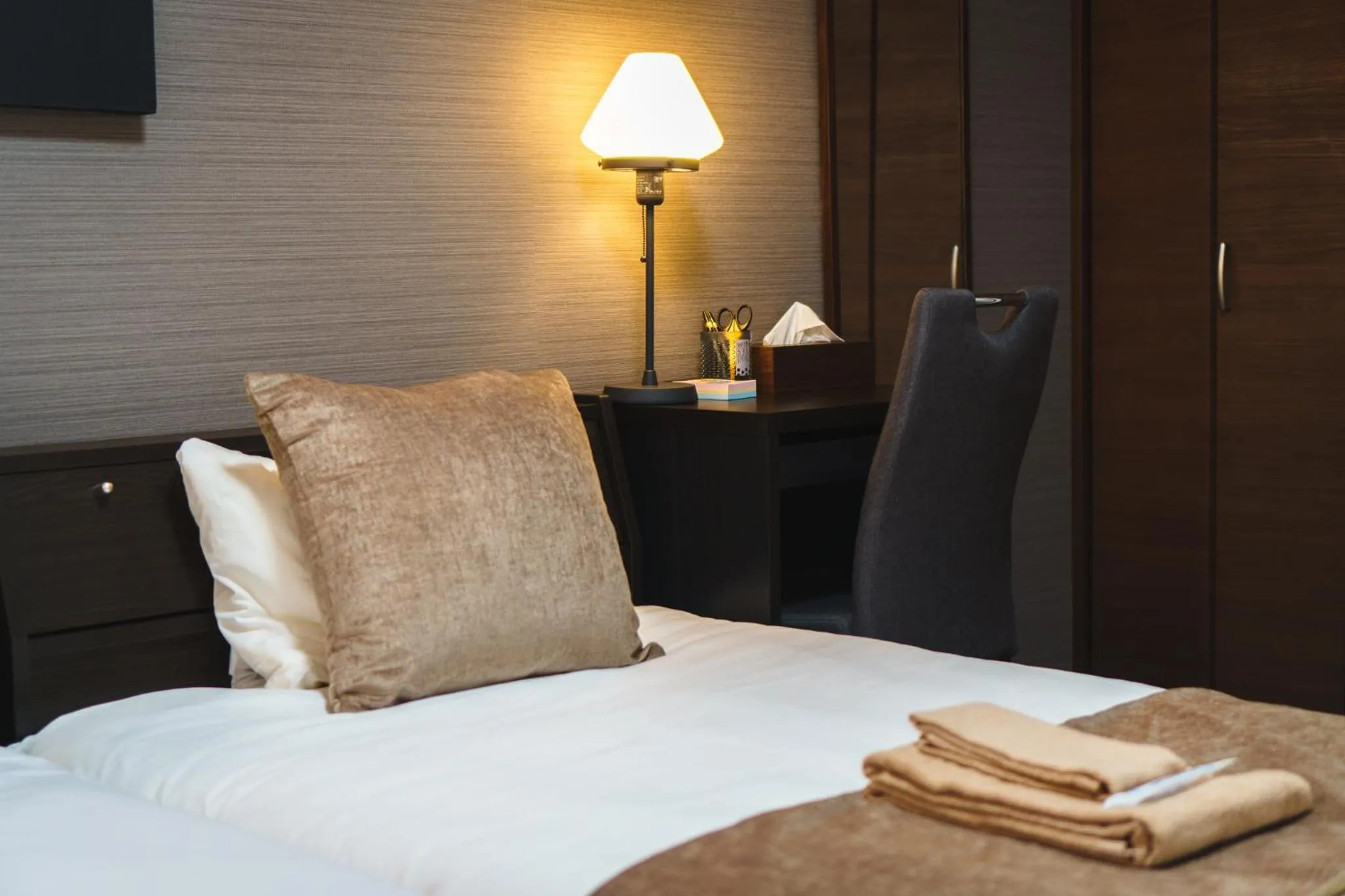 Bed in KINTARO Hotel Okinawa Naha