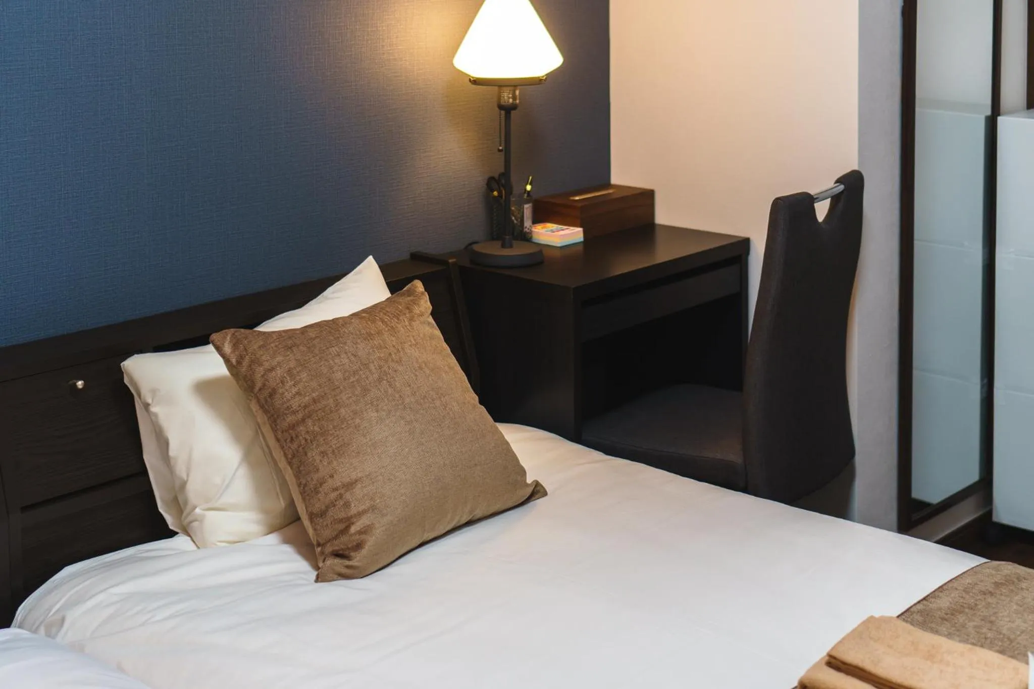 Bed in KINTARO Hotel Okinawa Naha