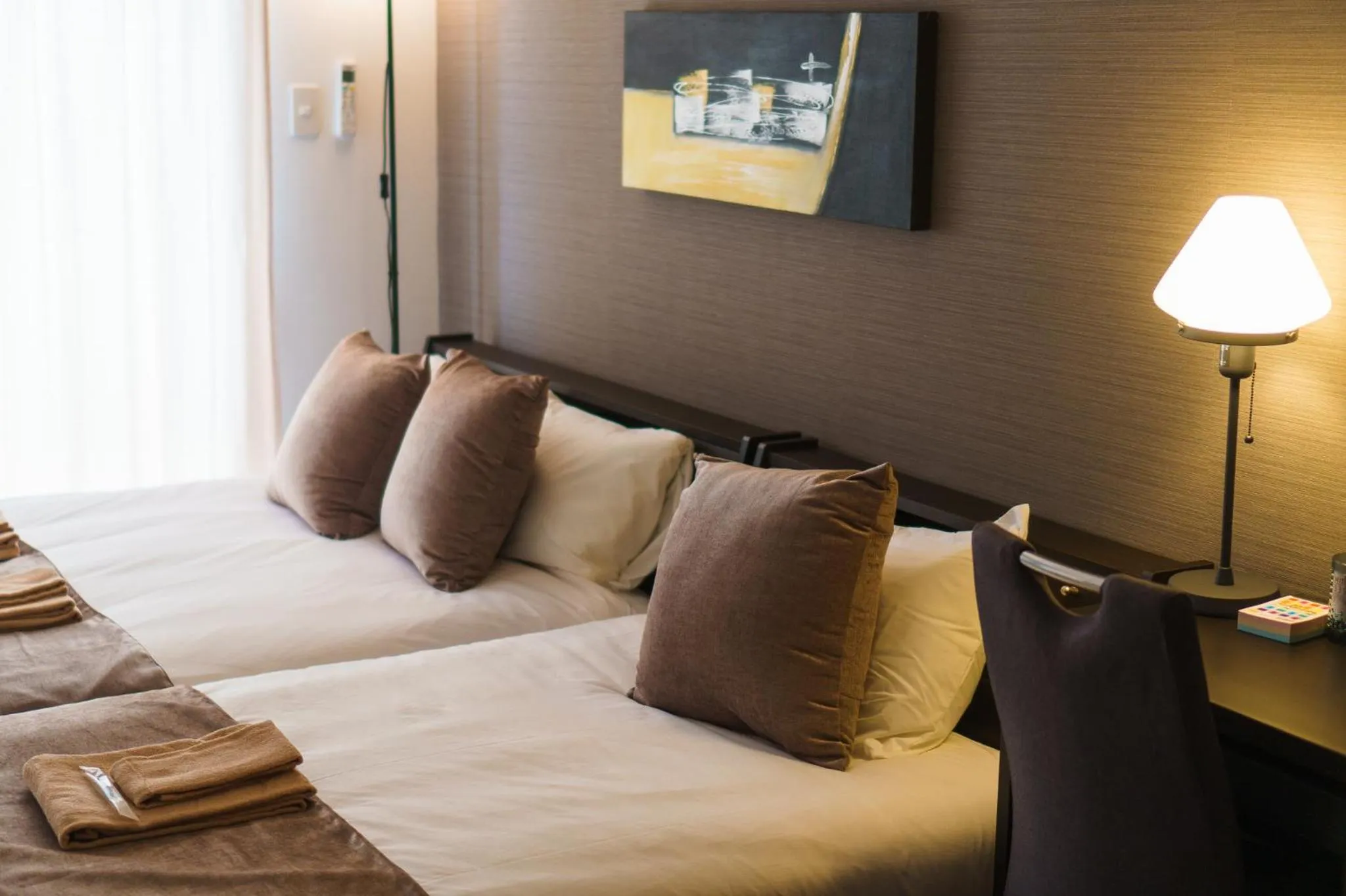 Bed in KINTARO Hotel Okinawa Naha