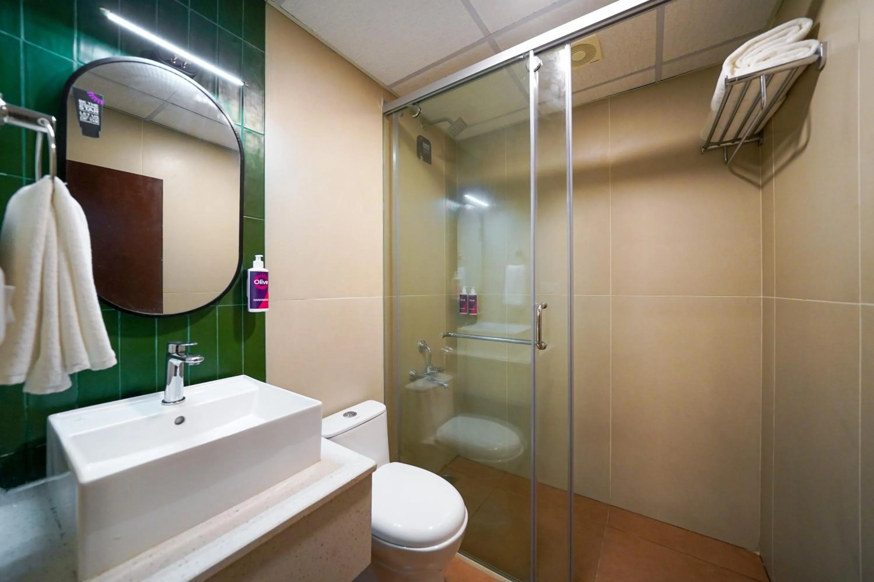 Shower in Olive Hotel Hosa Road Metro by Embassy Group