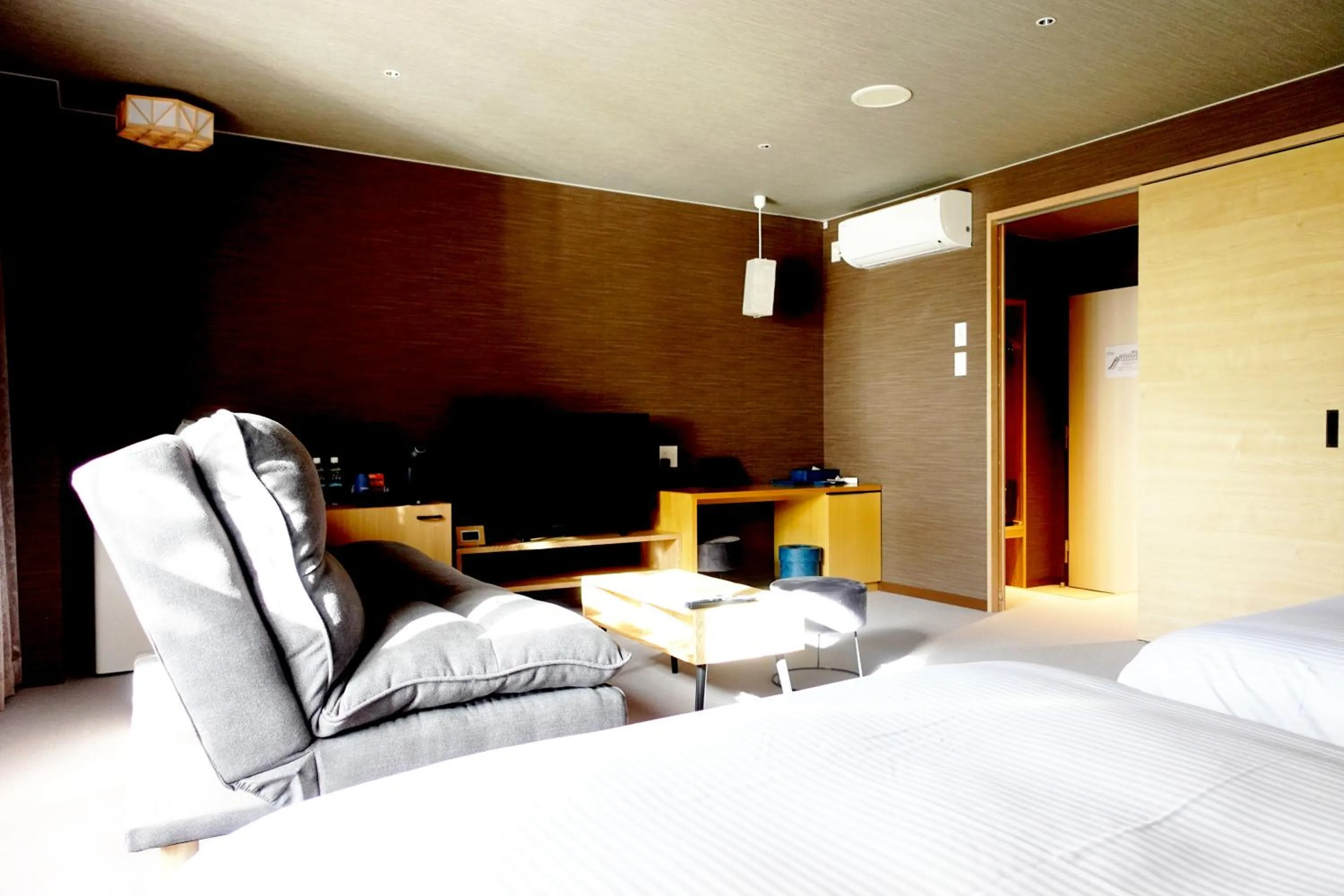 Living room, Bed in Resort Hotel RAKI House Nasu