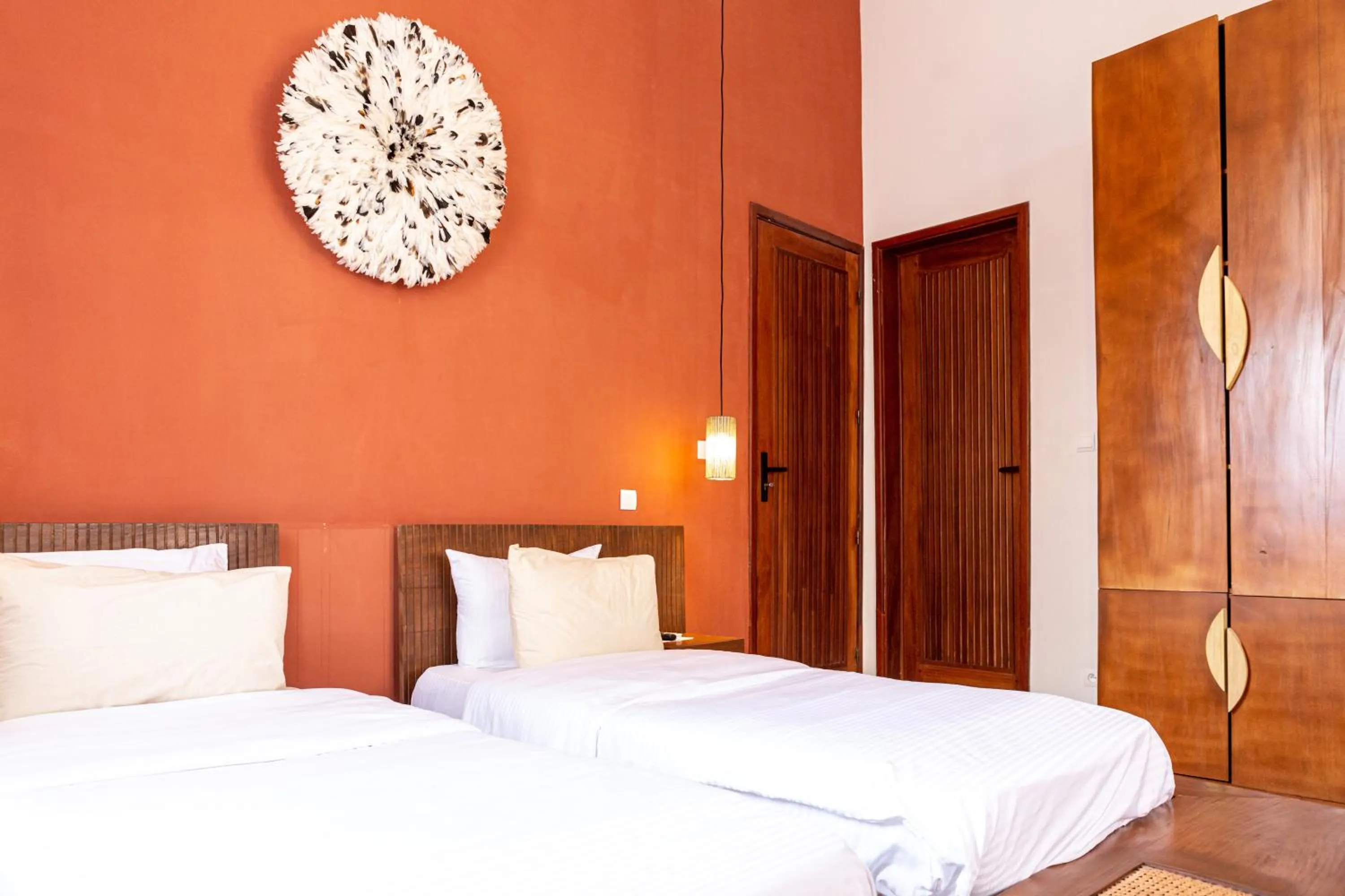 Bed in Tamarin Hôtel Cotonou