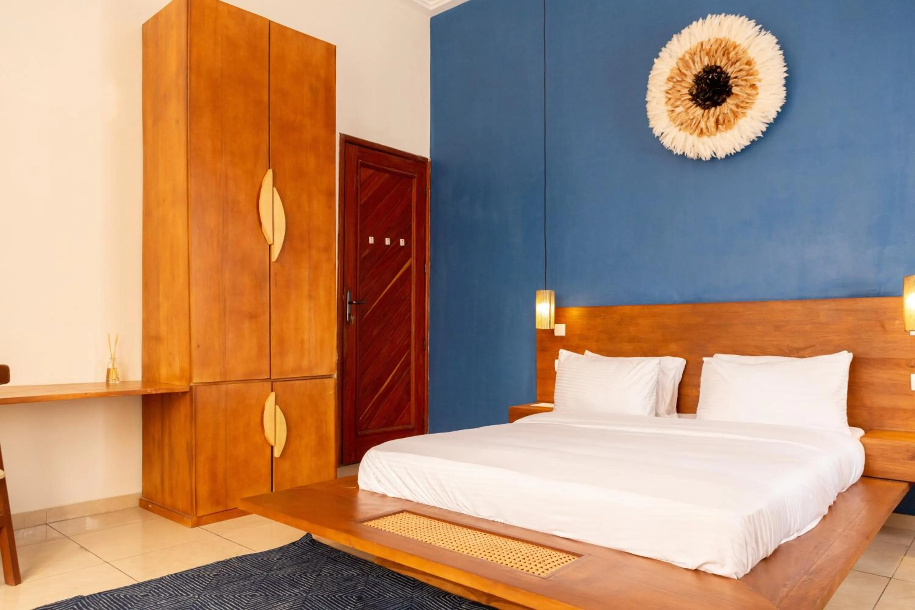 Bed in Tamarin Hôtel Cotonou