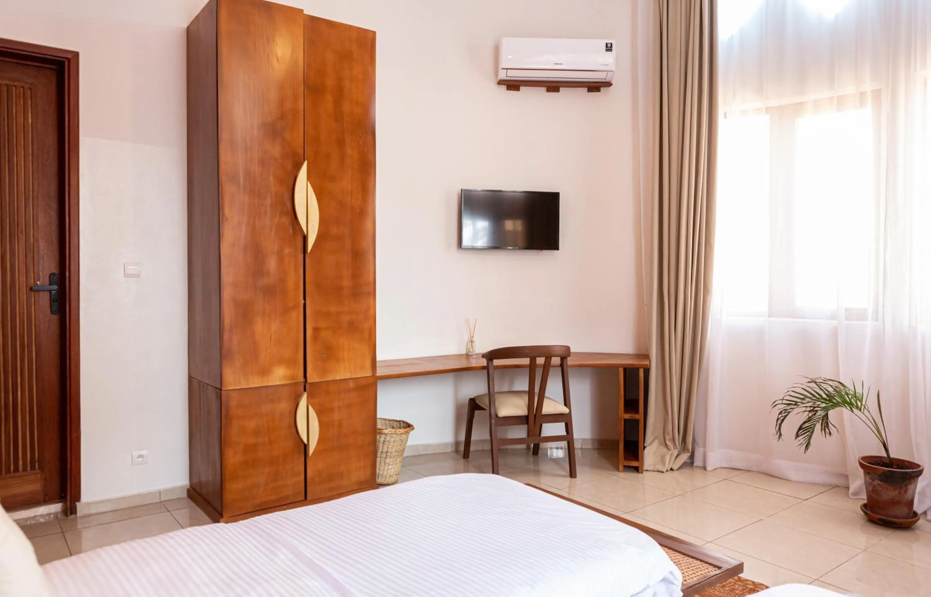 Bed in Tamarin Hôtel Cotonou