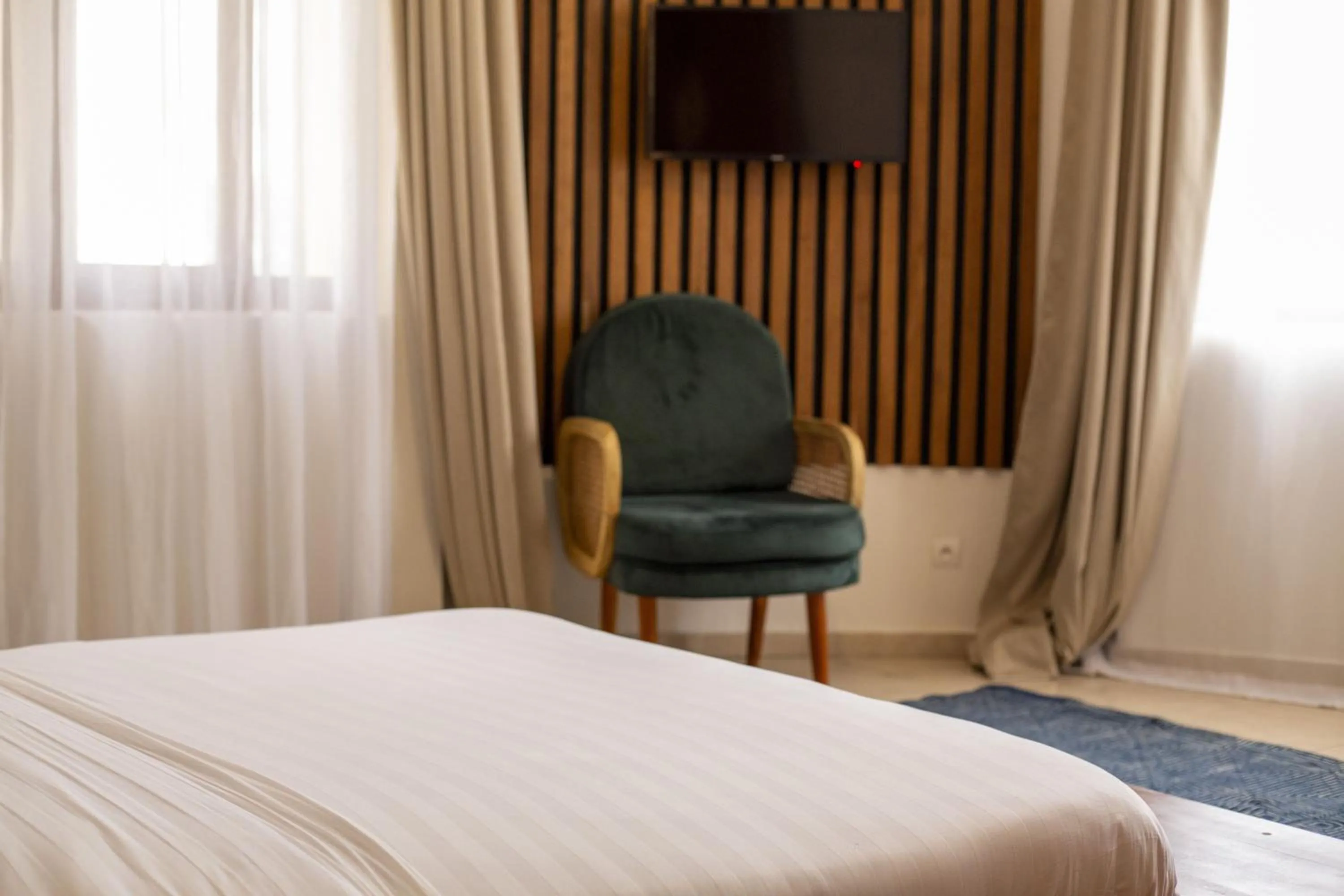 Bed in Tamarin Hôtel Cotonou