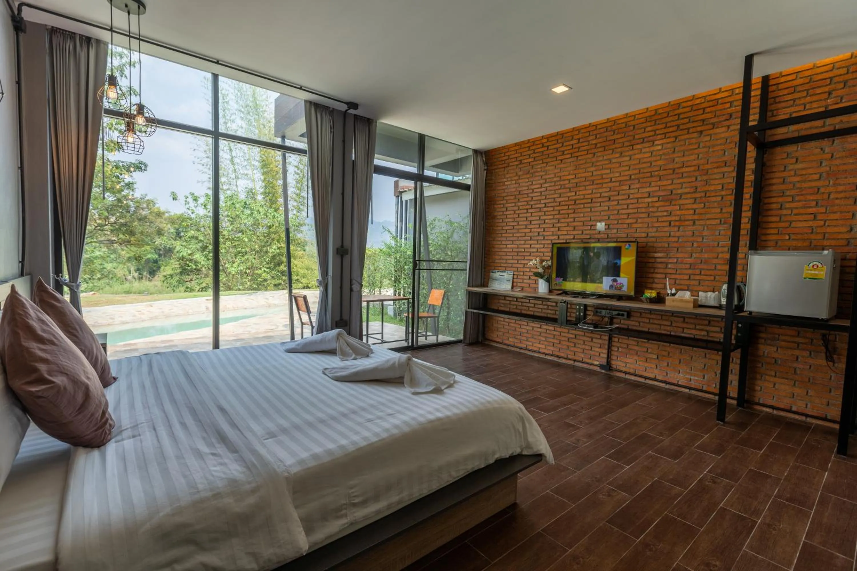 Bed in Kwai Tara Riverside Villas