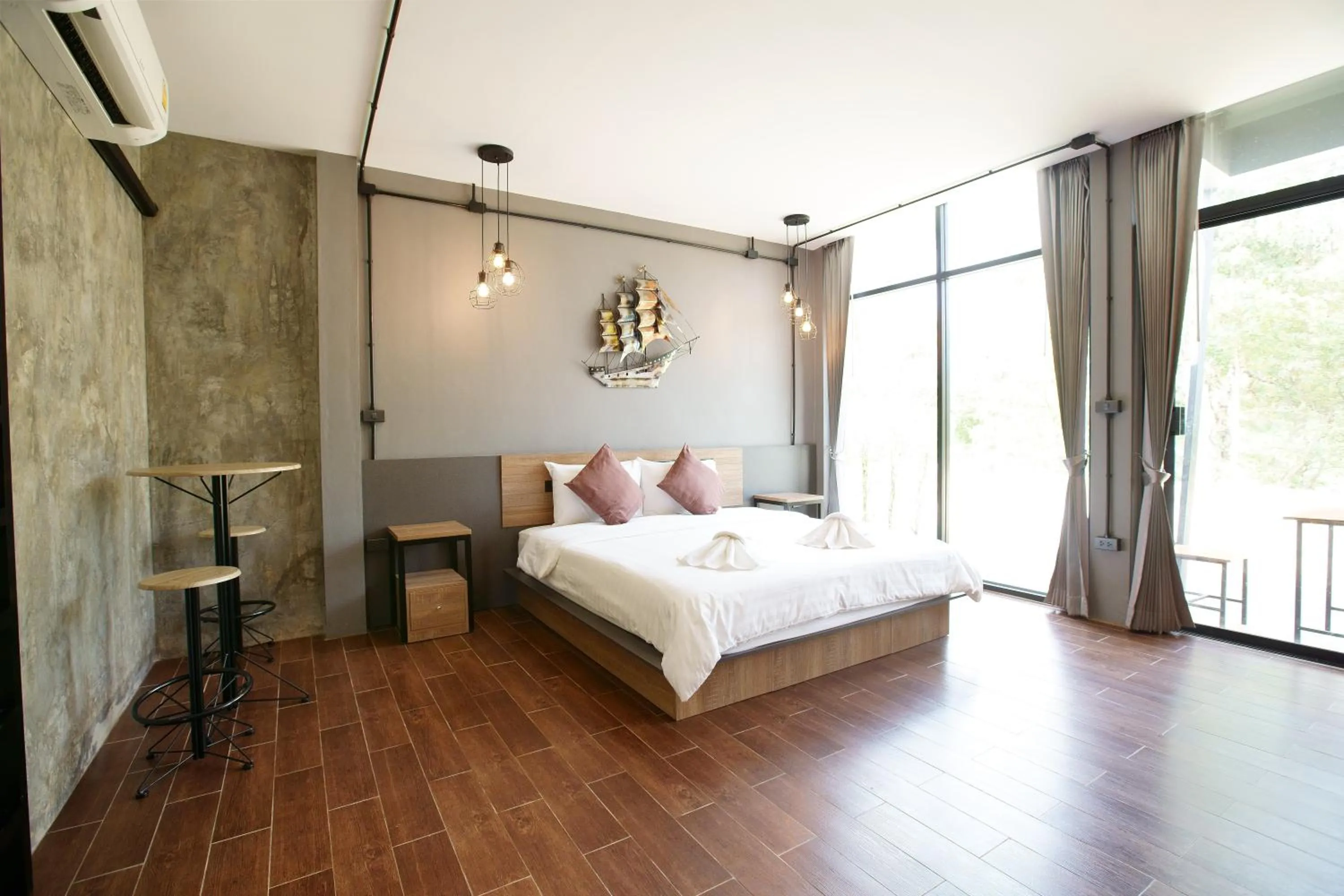 Bed in Kwai Tara Riverside Villas