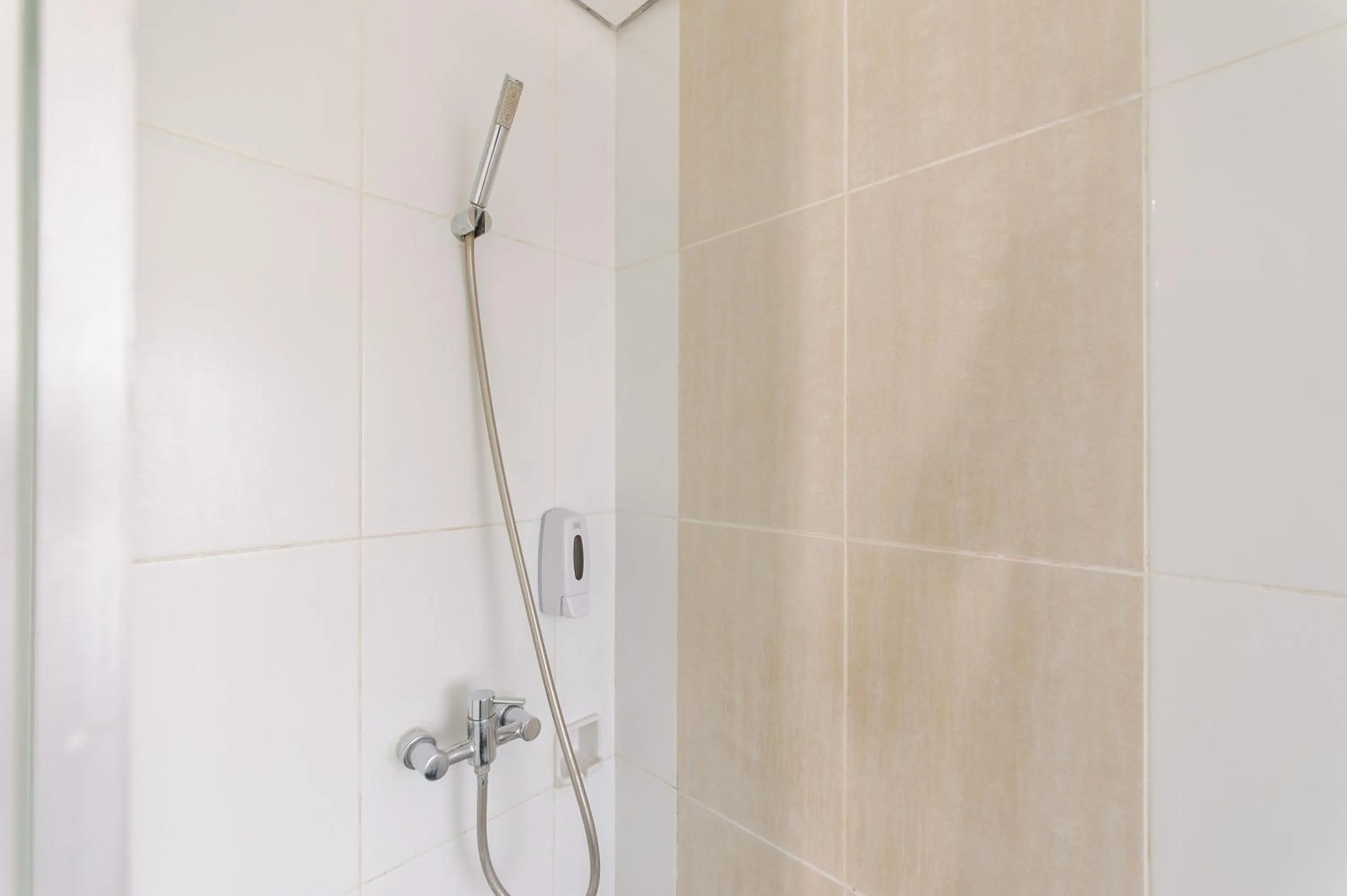 Bathroom in Sans Hotel The Green Bekasi by RedDoorz