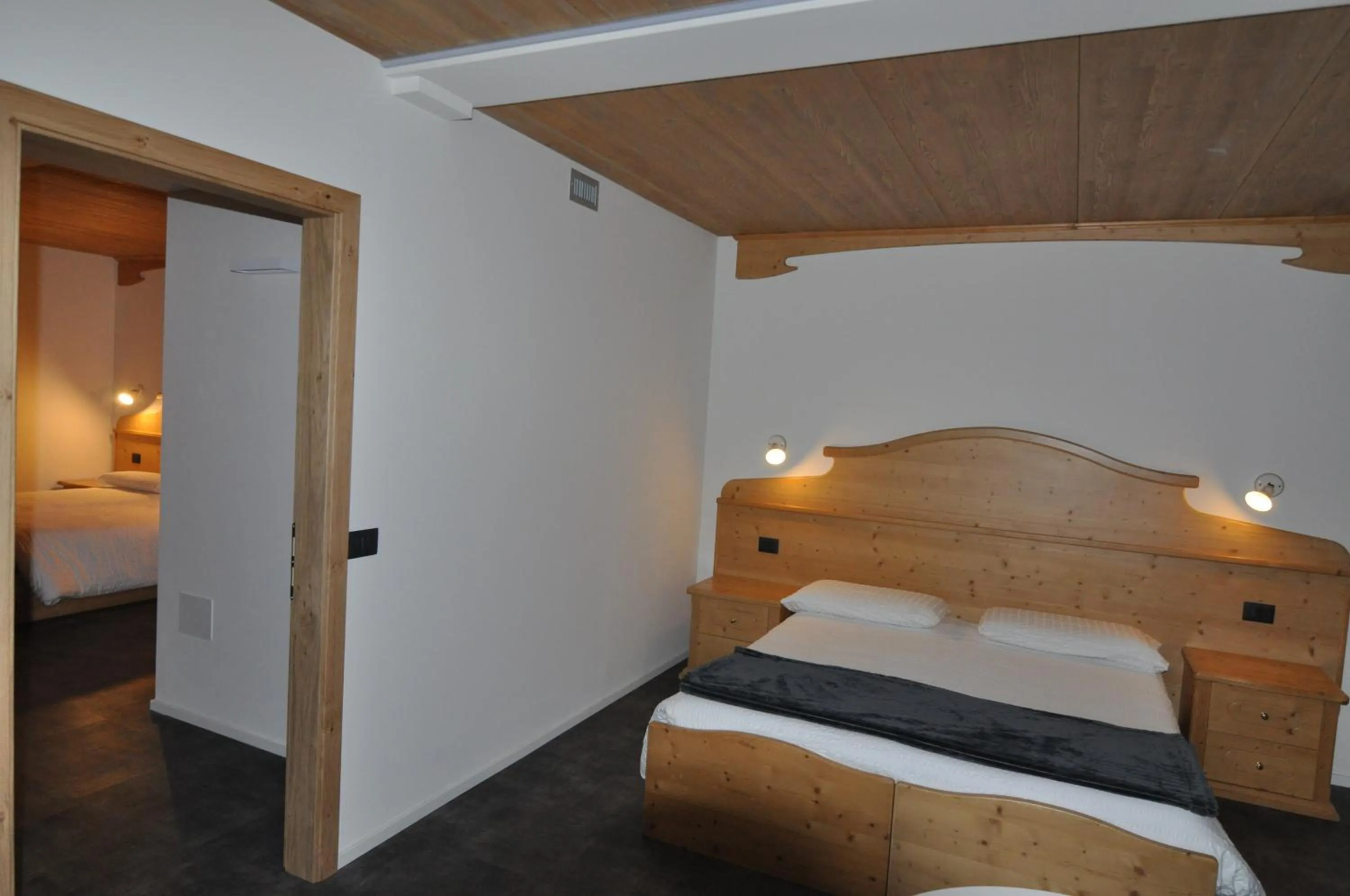 Bed in Albergo Alpino